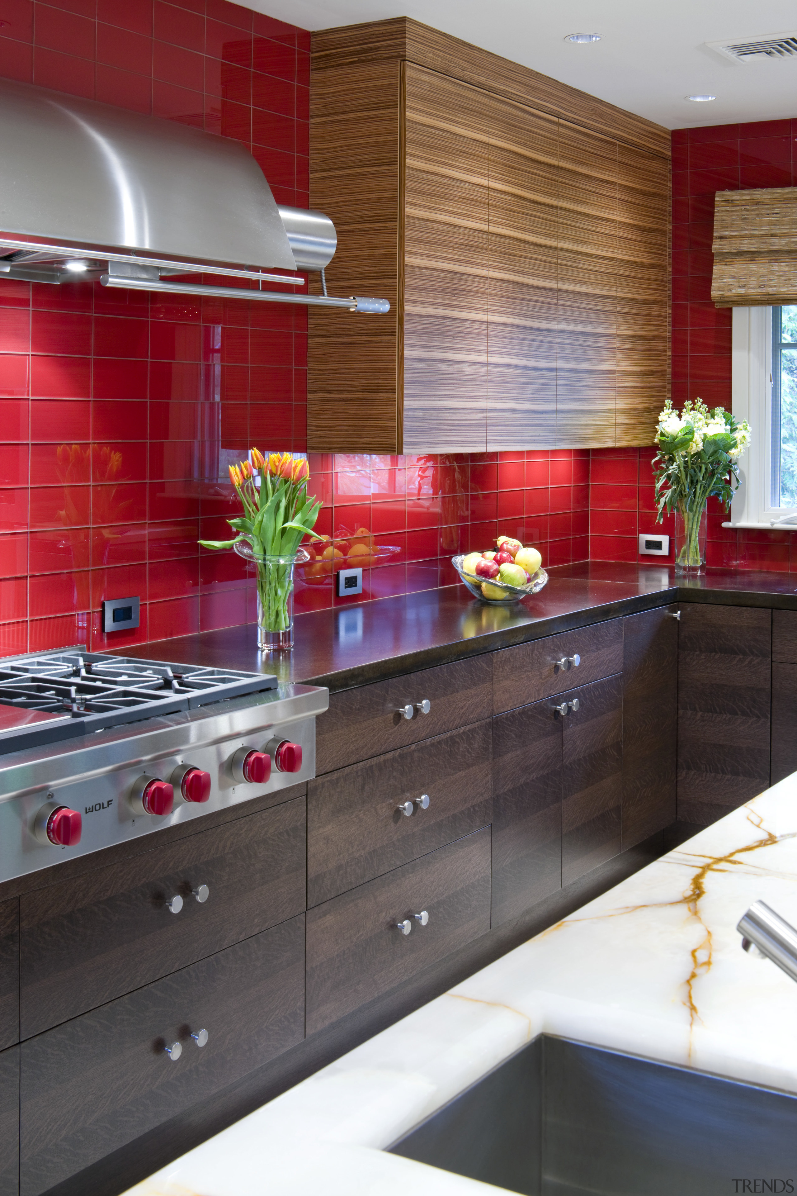 View of a contemporary kitchen which features a cabinetry, countertop, cuisine classique, interior design, kitchen, room, red