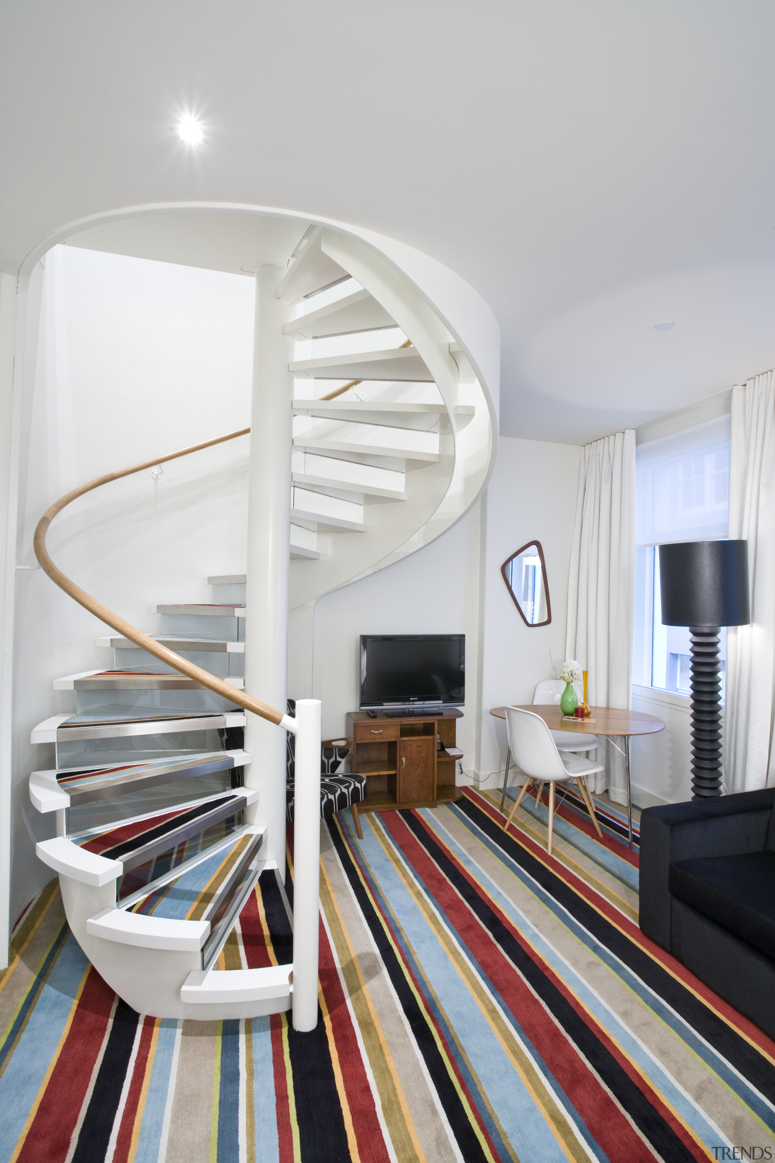 view of a spiral staircase leading up to architecture, furniture, home, interior design, product design, stairs, table, gray, white