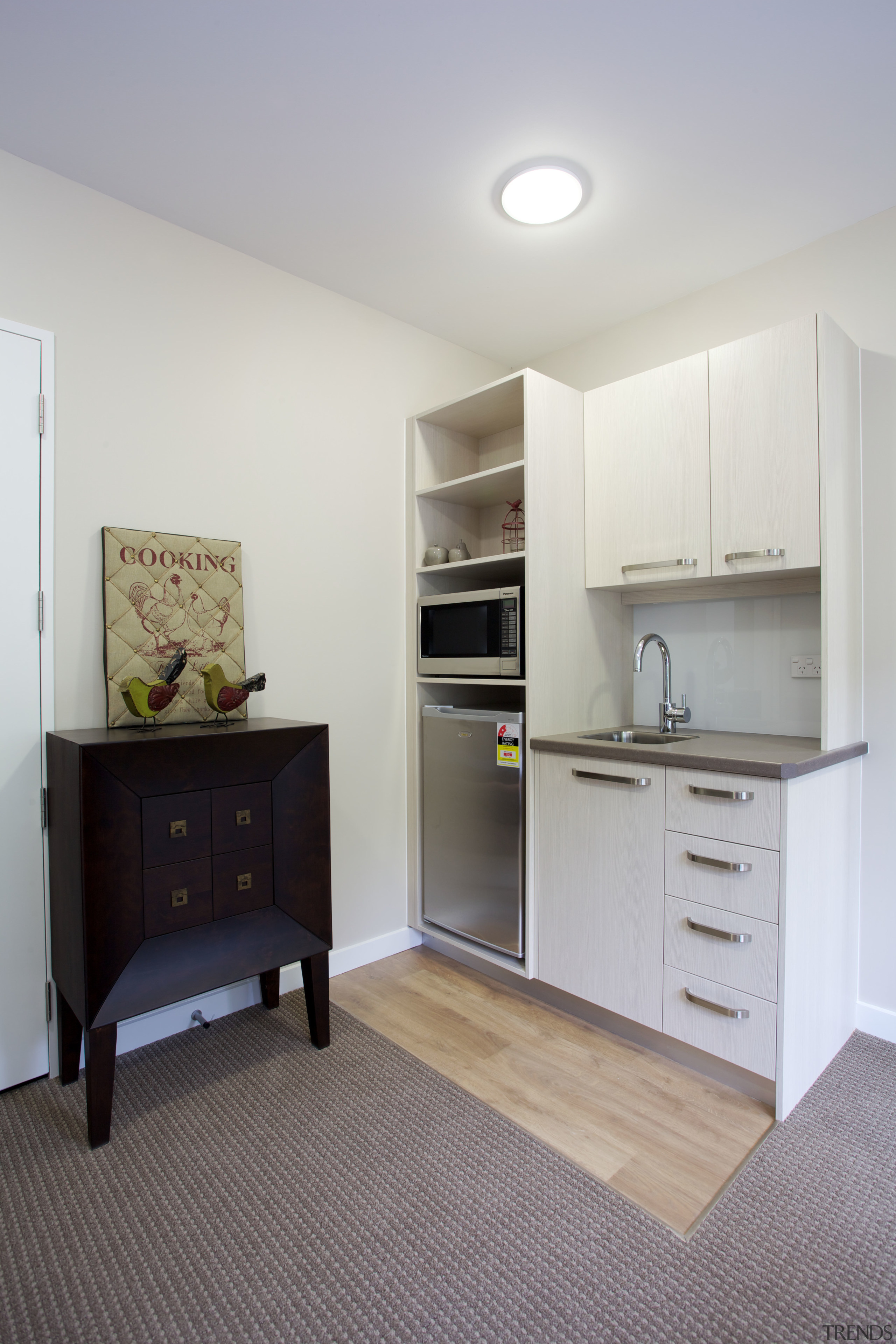 Polyflor cushion vinyl in Forest Oak makes a cabinetry, floor, home, home appliance, interior design, kitchen, real estate, room, gray