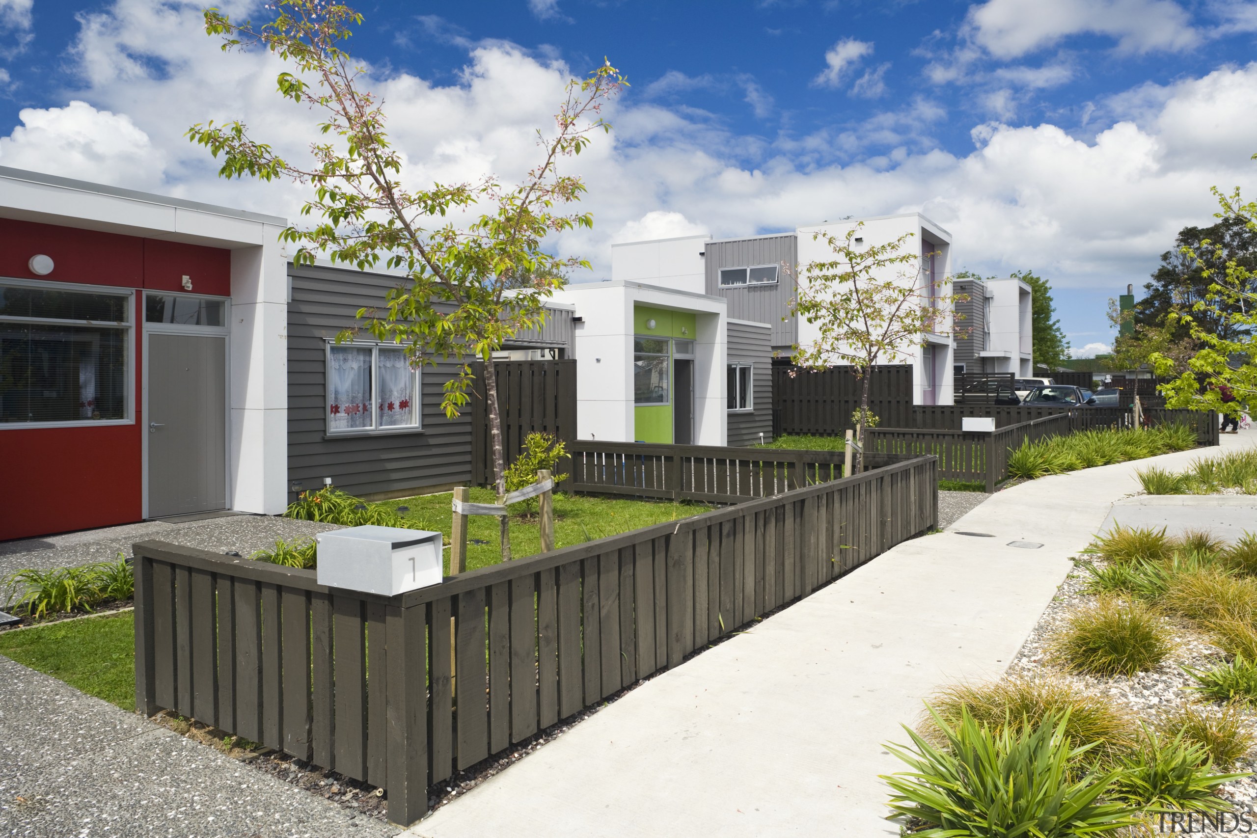 This Housing New Zealand Devlopment features modular homes, architecture, elevation, facade, home, house, mixed use, neighbourhood, property, real estate, residential area, white