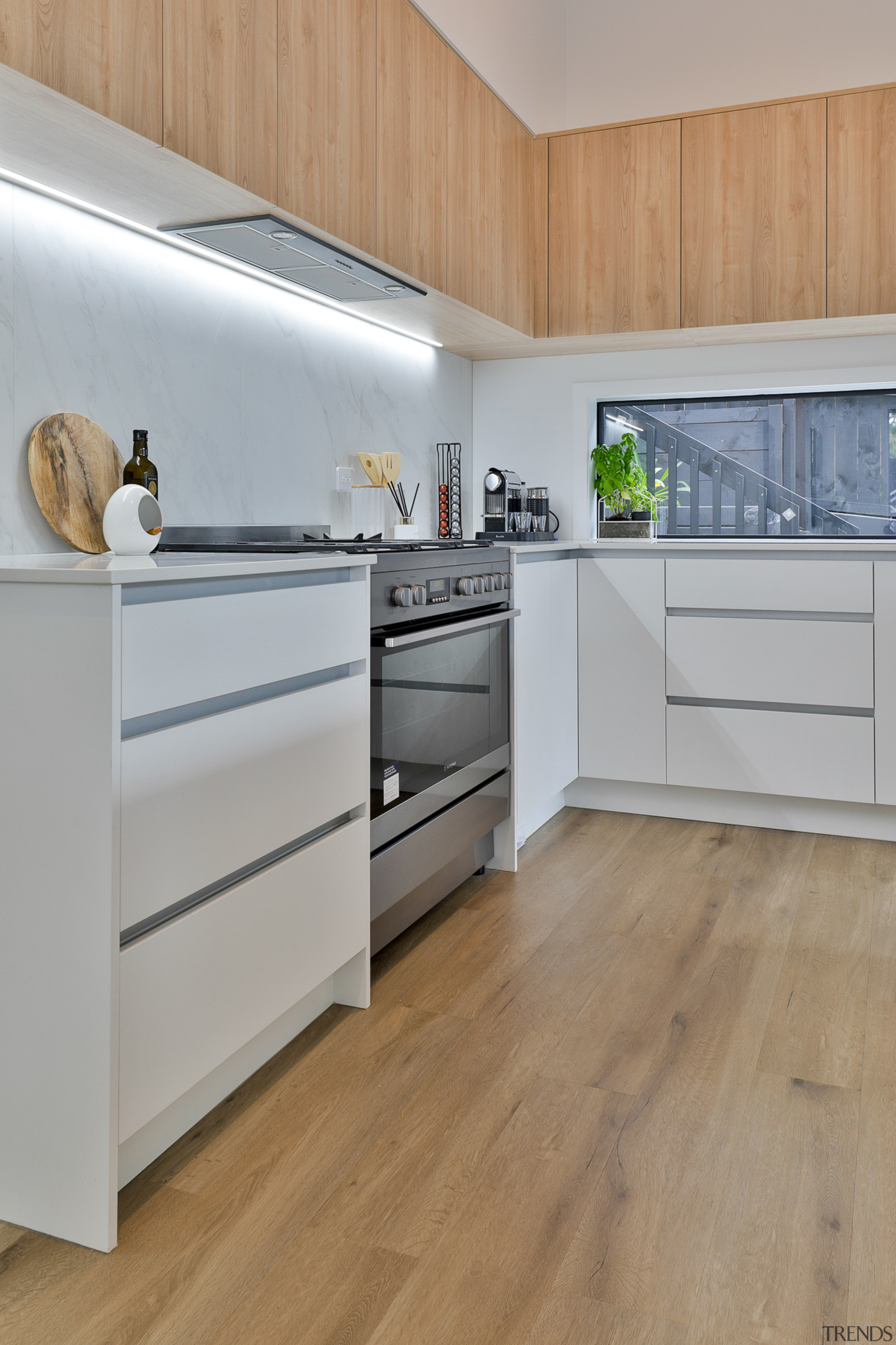 Wood cabinetry harmonises with the look of the 