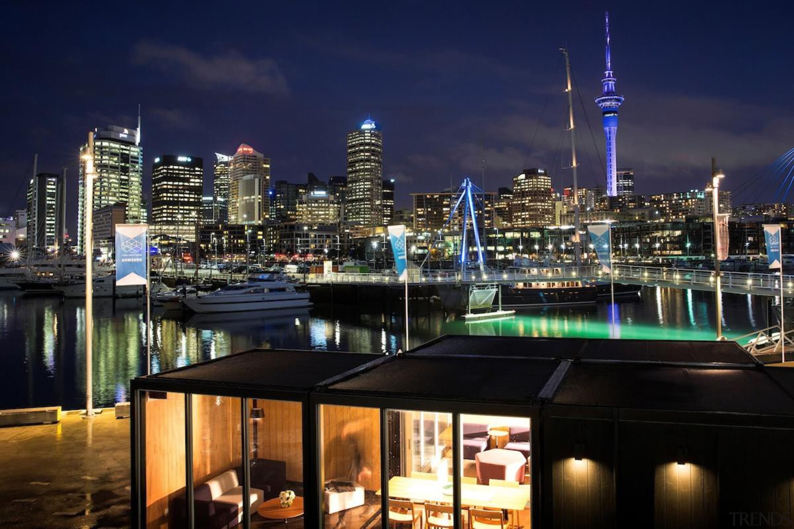 Samsung Electronics New Zealand has revealed its Home city, cityscape, downtown, marina, metropolis, metropolitan area, night, reflection, sky, skyline, skyscraper, tourist attraction, tower block, water, black, blue
