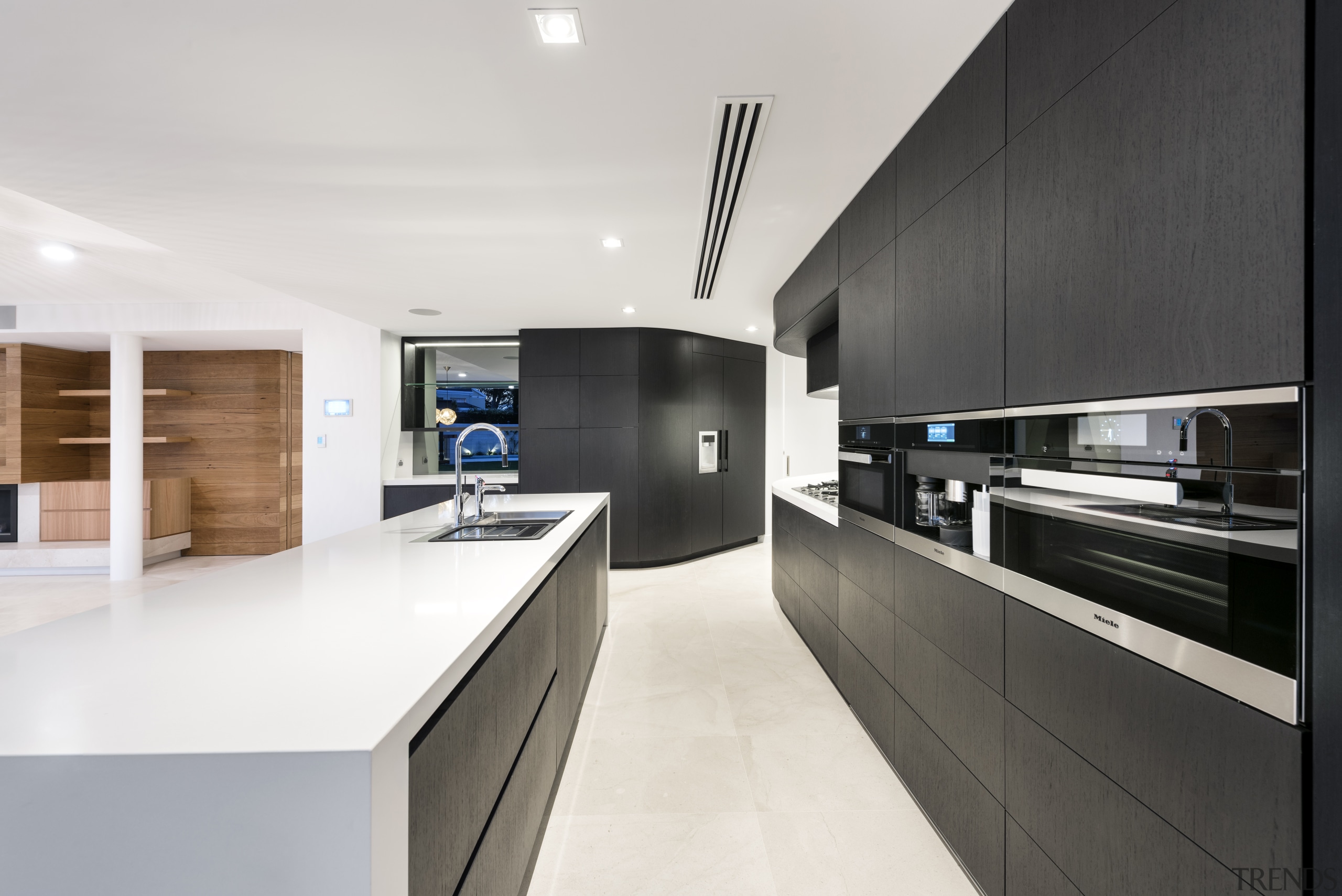 On this project by Hillam Architects, push-to-open handles architecture, countertop, interior design, kitchen, product design, real estate, white, black