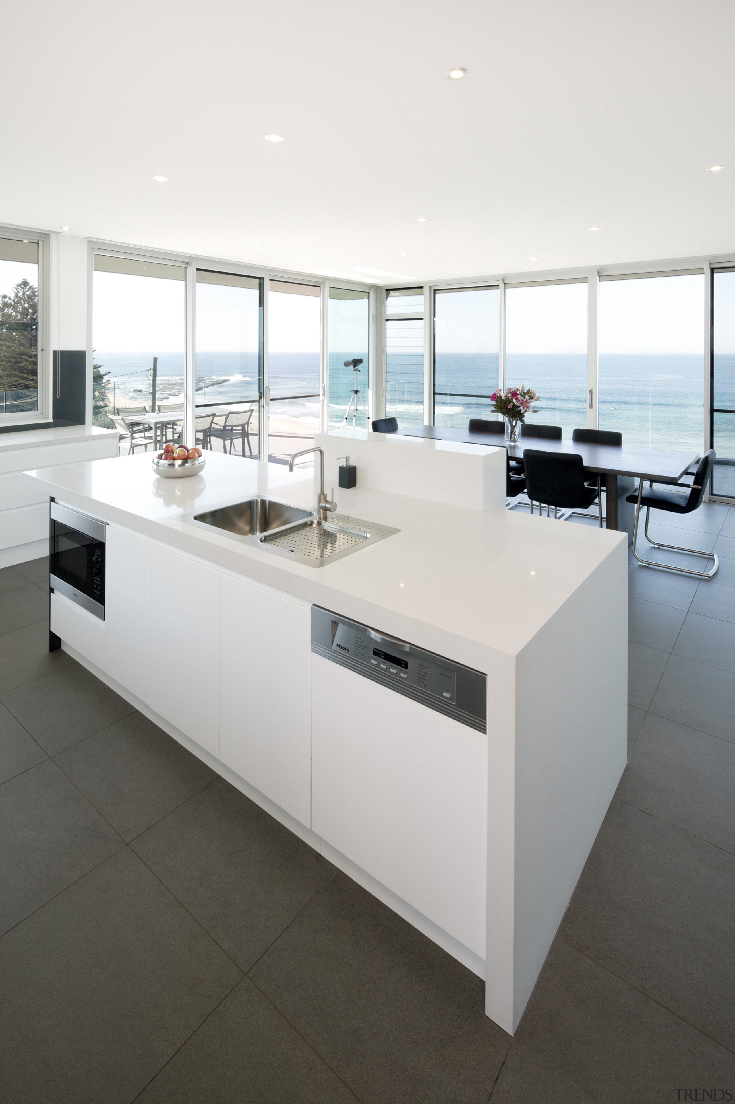 View of kitchen and dining area  designed floor, furniture, interior design, product design, table, white
