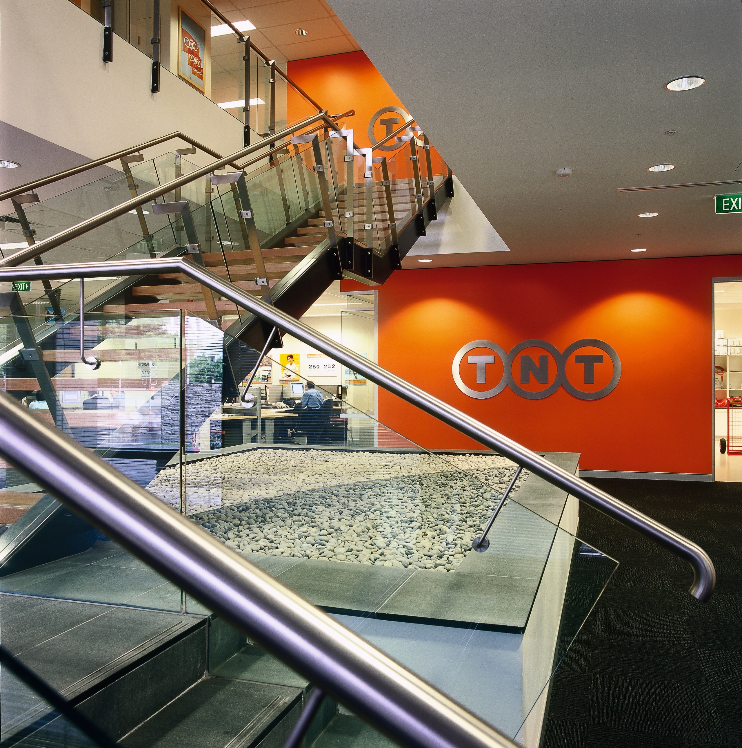 View of the steps to offices above, tiled architecture, escalator, glass, handrail, interior design, gray