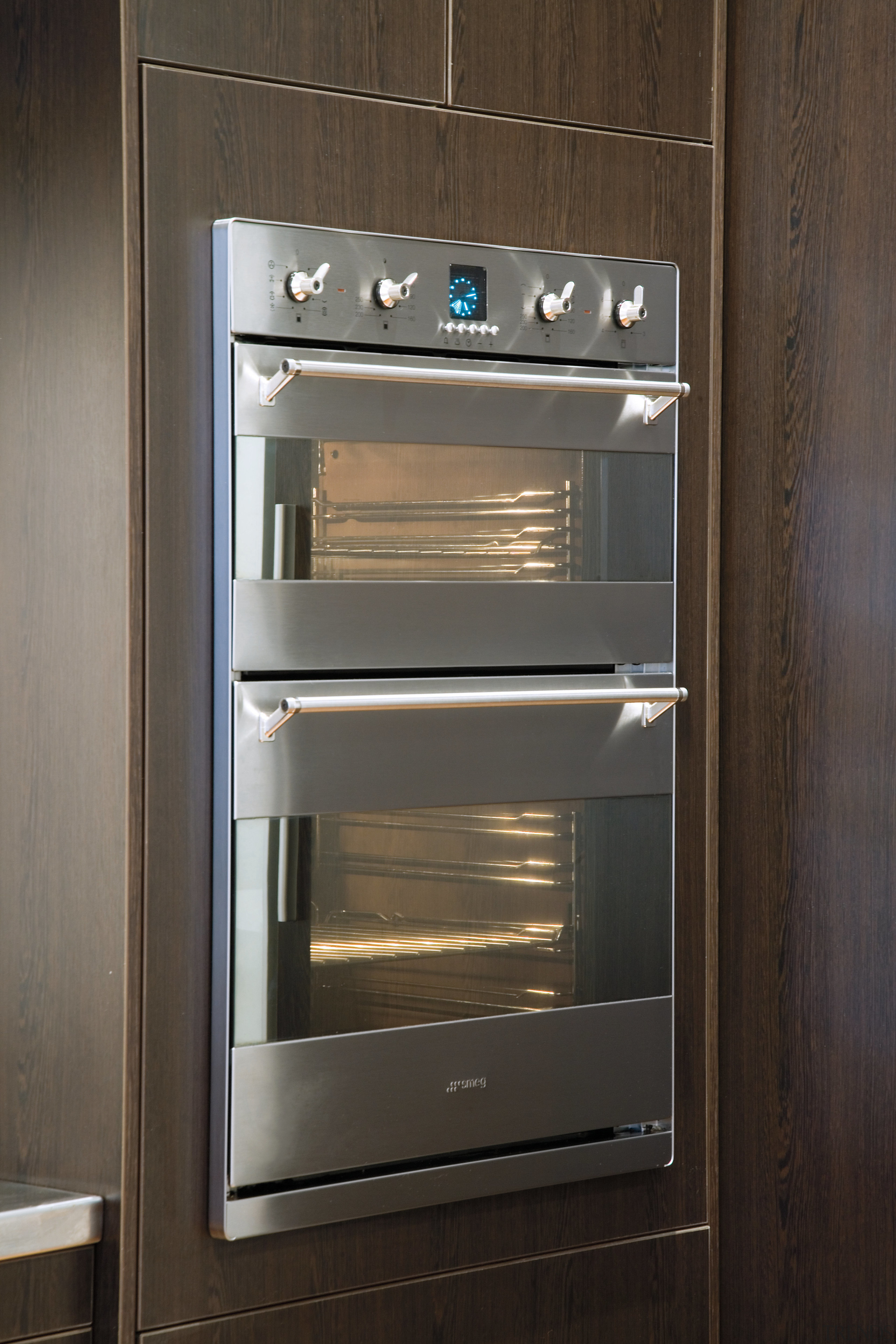 A view of the modern Smeg stainless steel gas stove, home appliance, kitchen appliance, kitchen stove, major appliance, microwave oven, oven, black, gray