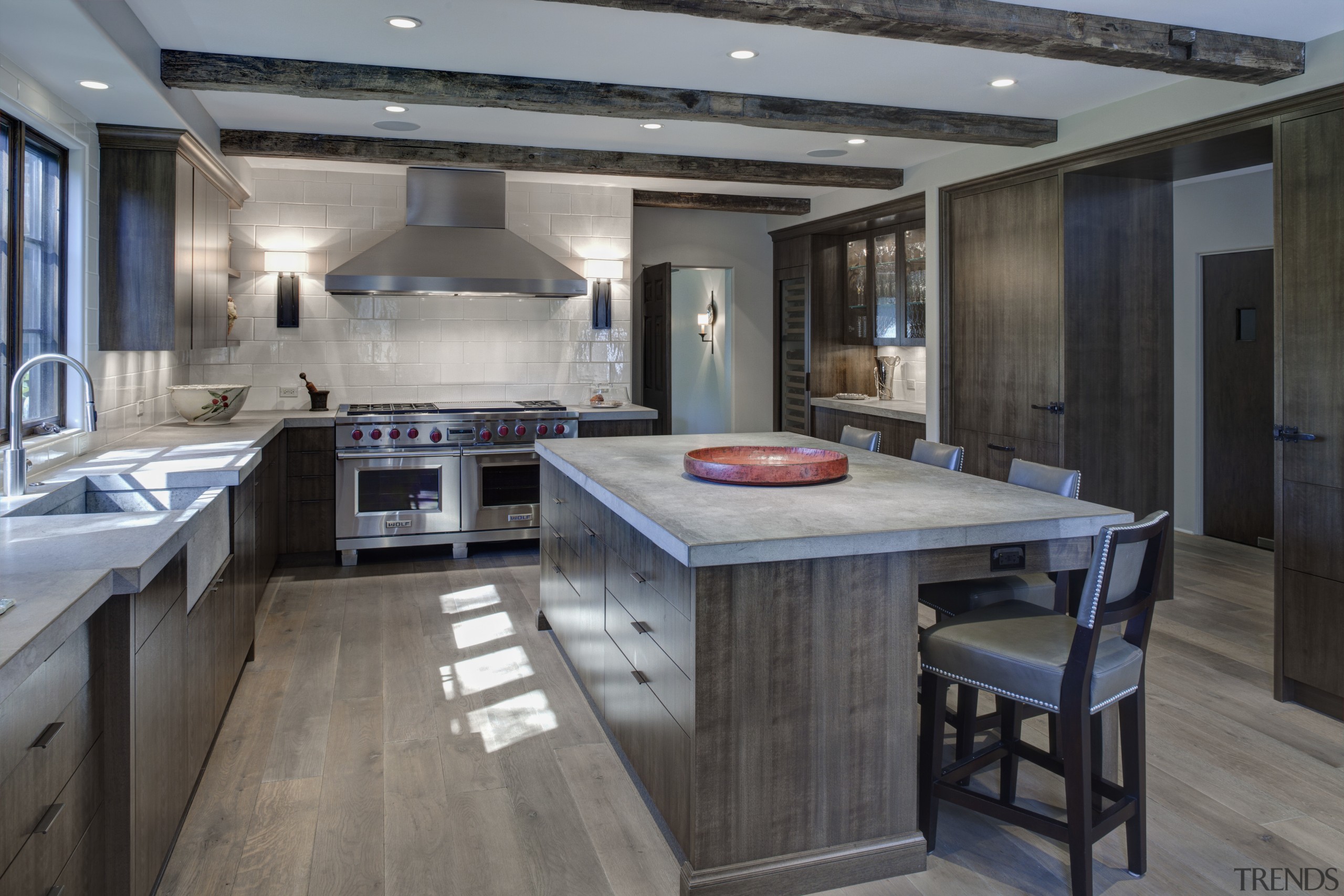 In this kitchen remodel by Doug Durbin, the countertop, floor, flooring, interior design, kitchen, gray, black