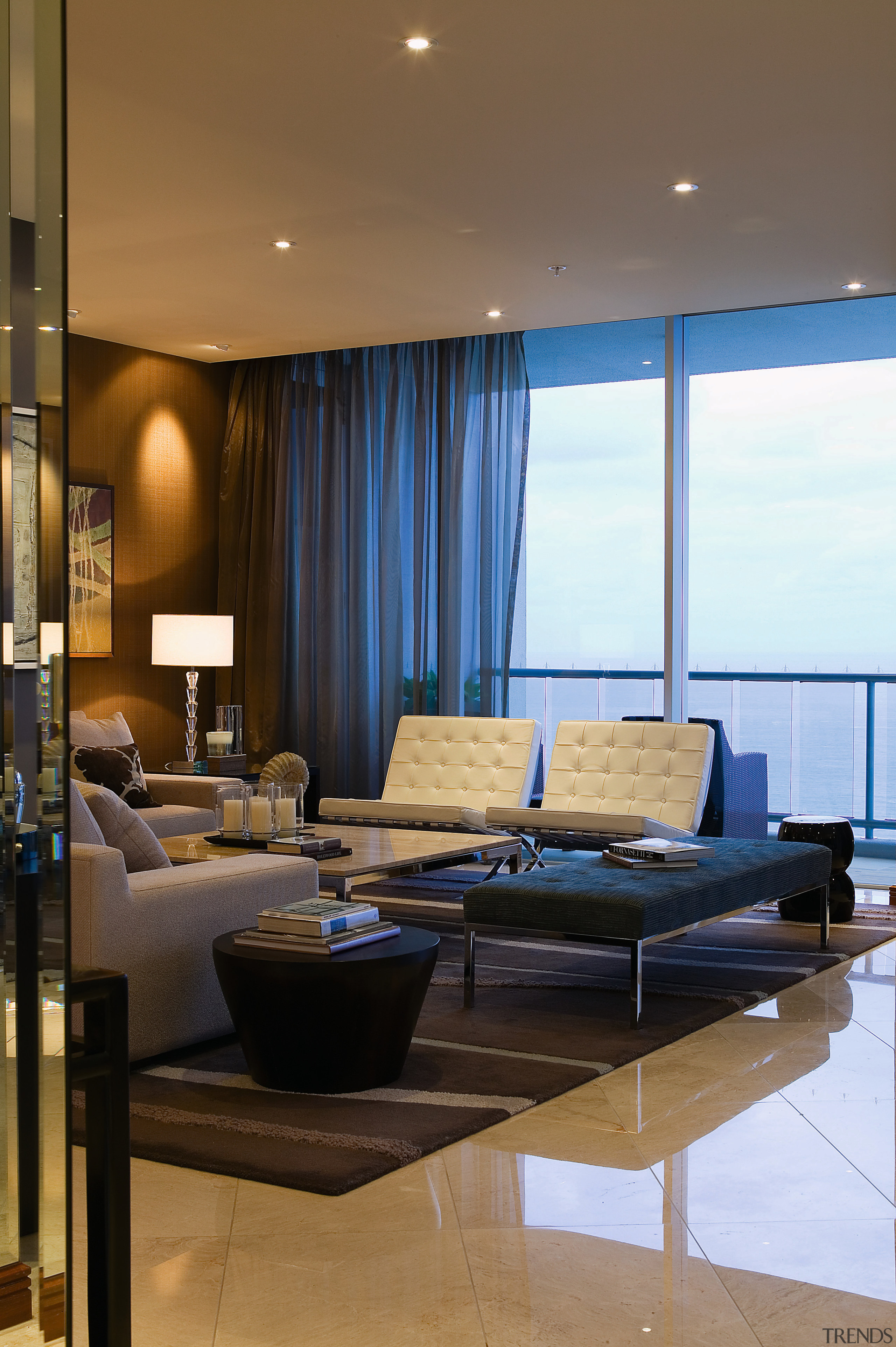 view of the living area featuring contemporary furniture, architecture, ceiling, interior design, living room, room, brown