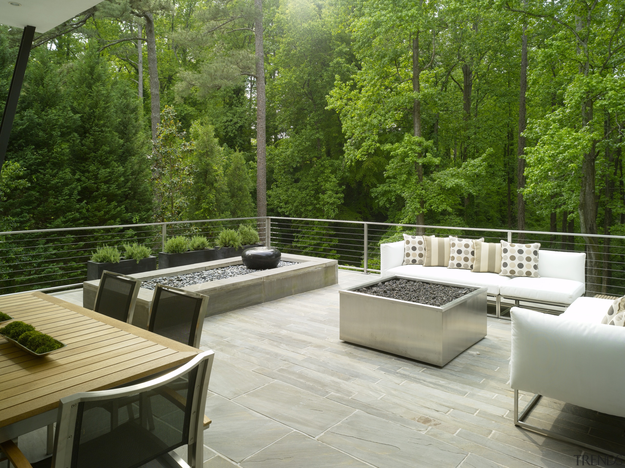 View of balcony with trees. - View of backyard, furniture, interior design, outdoor structure, patio, real estate, table, green