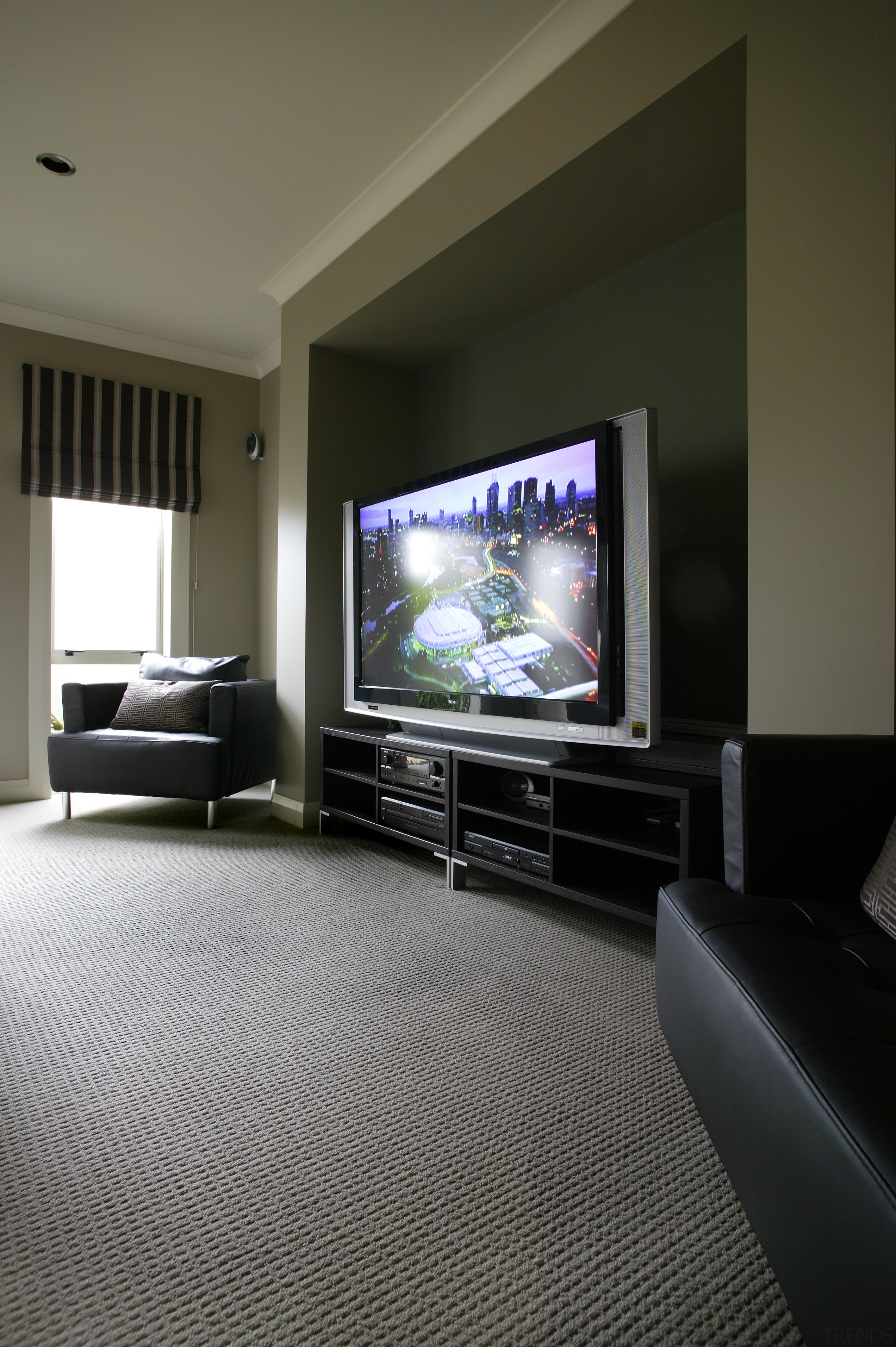 A view of some carpet from Cavalier Bremworth. display device, flat panel display, floor, flooring, home, interior design, living room, multimedia, room, black, gray