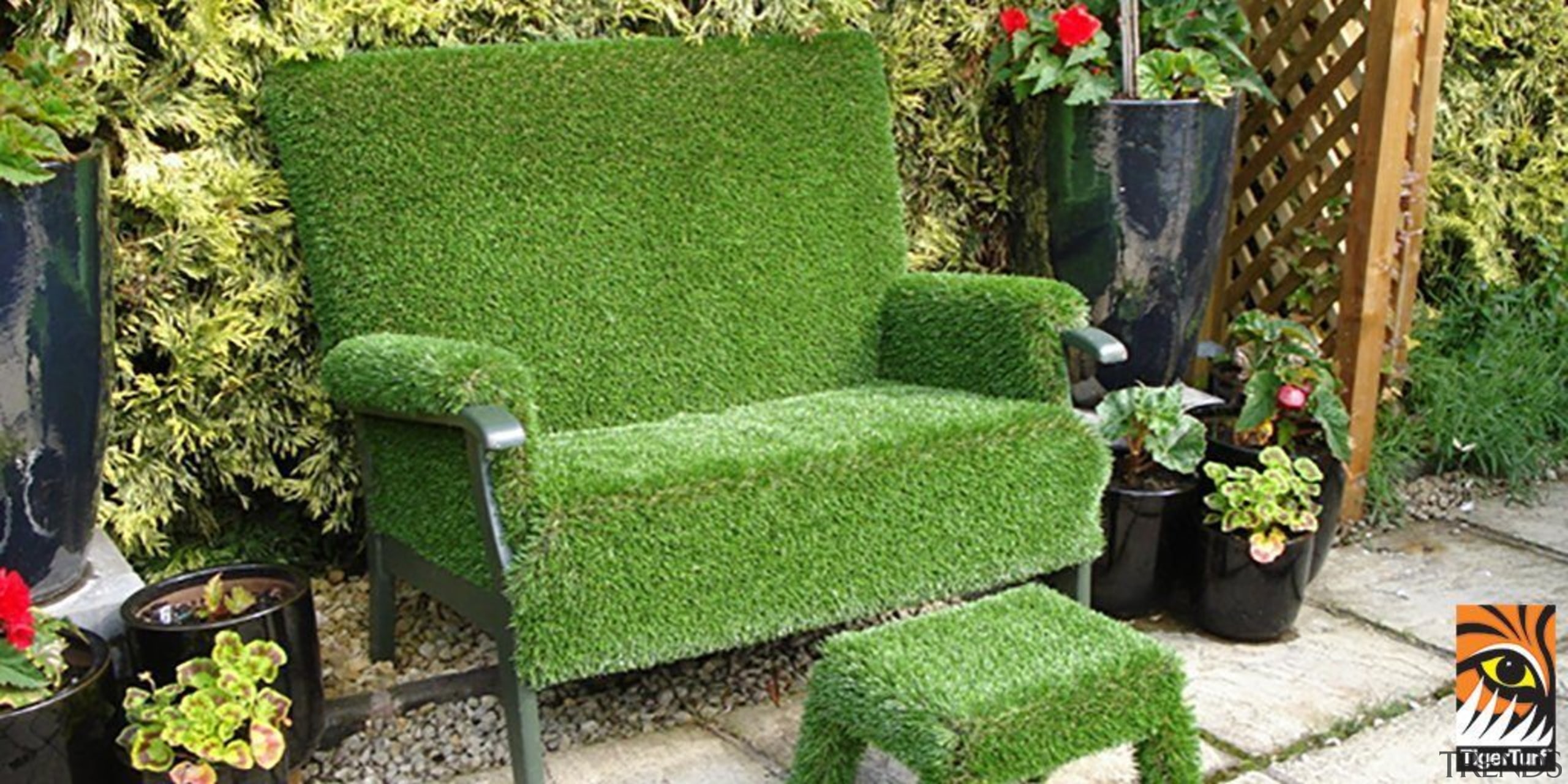 A chair furnished with TigerTurf for added backyard, chair, furniture, garden, grass, hedge, landscaping, lawn, outdoor furniture, outdoor structure, plant, shrub, tree, yard, green
