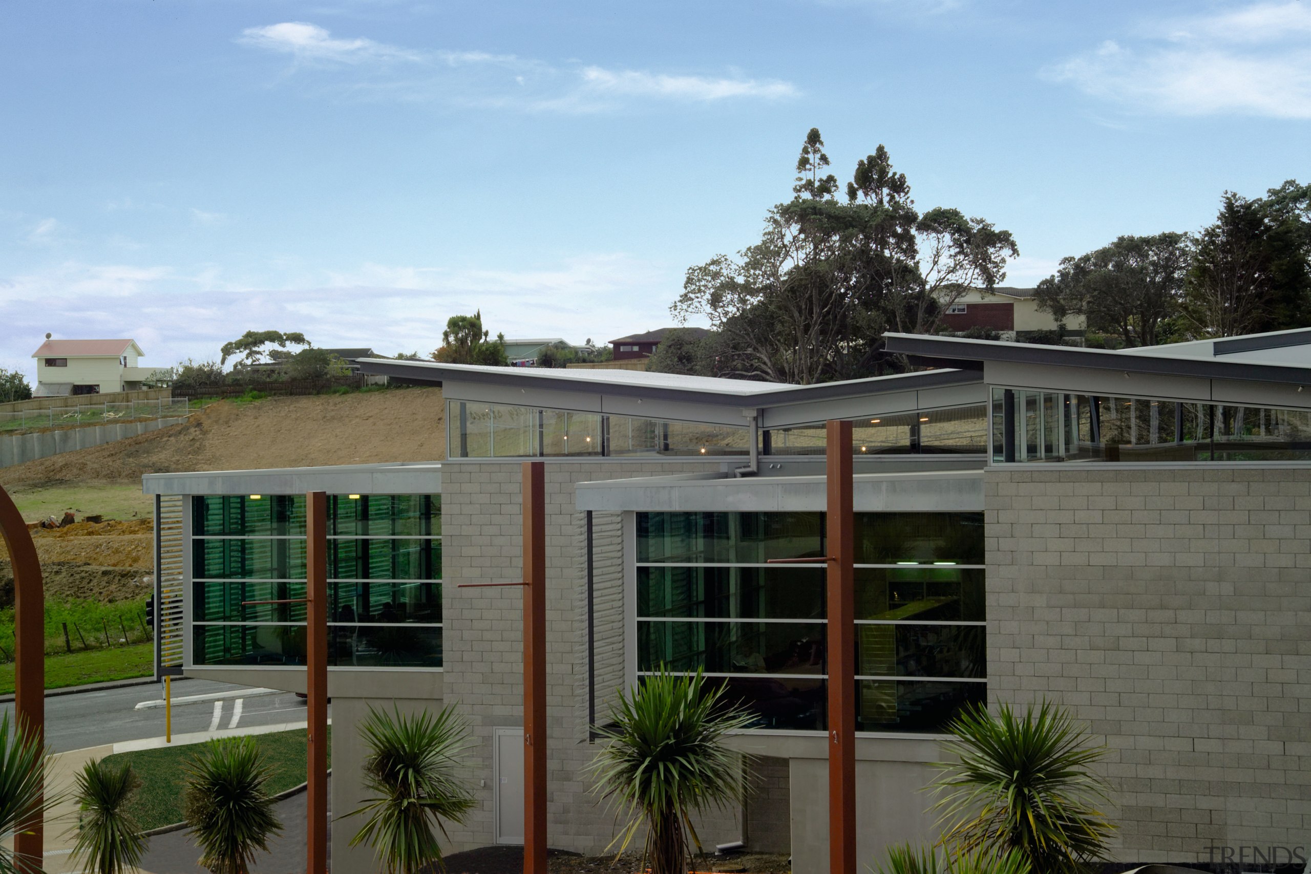 view of the library  featuring galvanised steel architecture, facade, home, house, property, real estate, residential area, roof, window, teal, gray