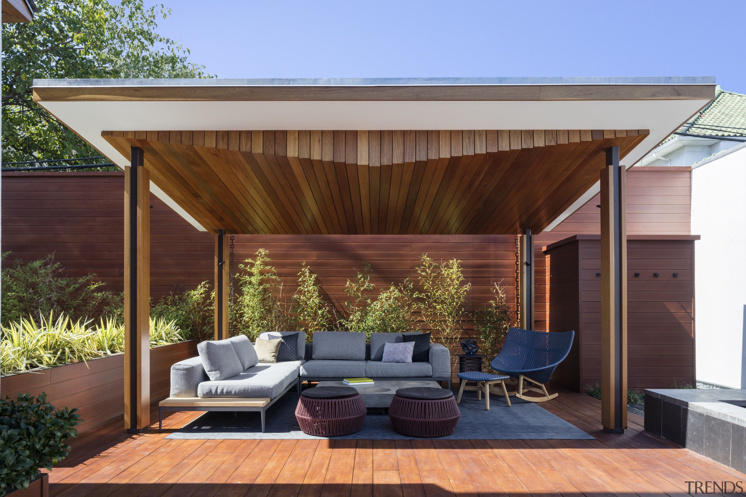 The outdoor room or pavilion includes a feature 