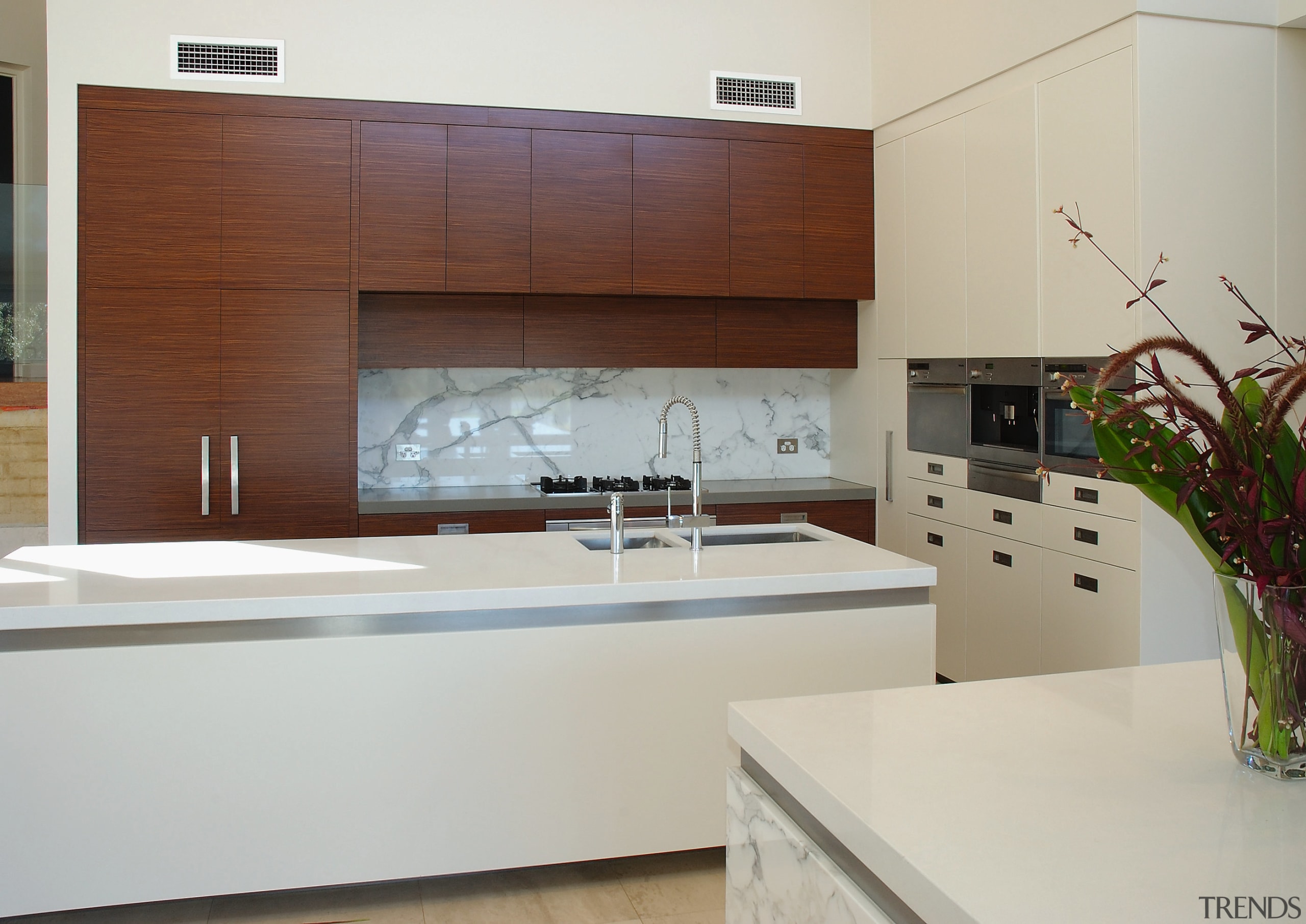 The island in this kitchen have benchtops of cabinetry, countertop, interior design, kitchen, gray