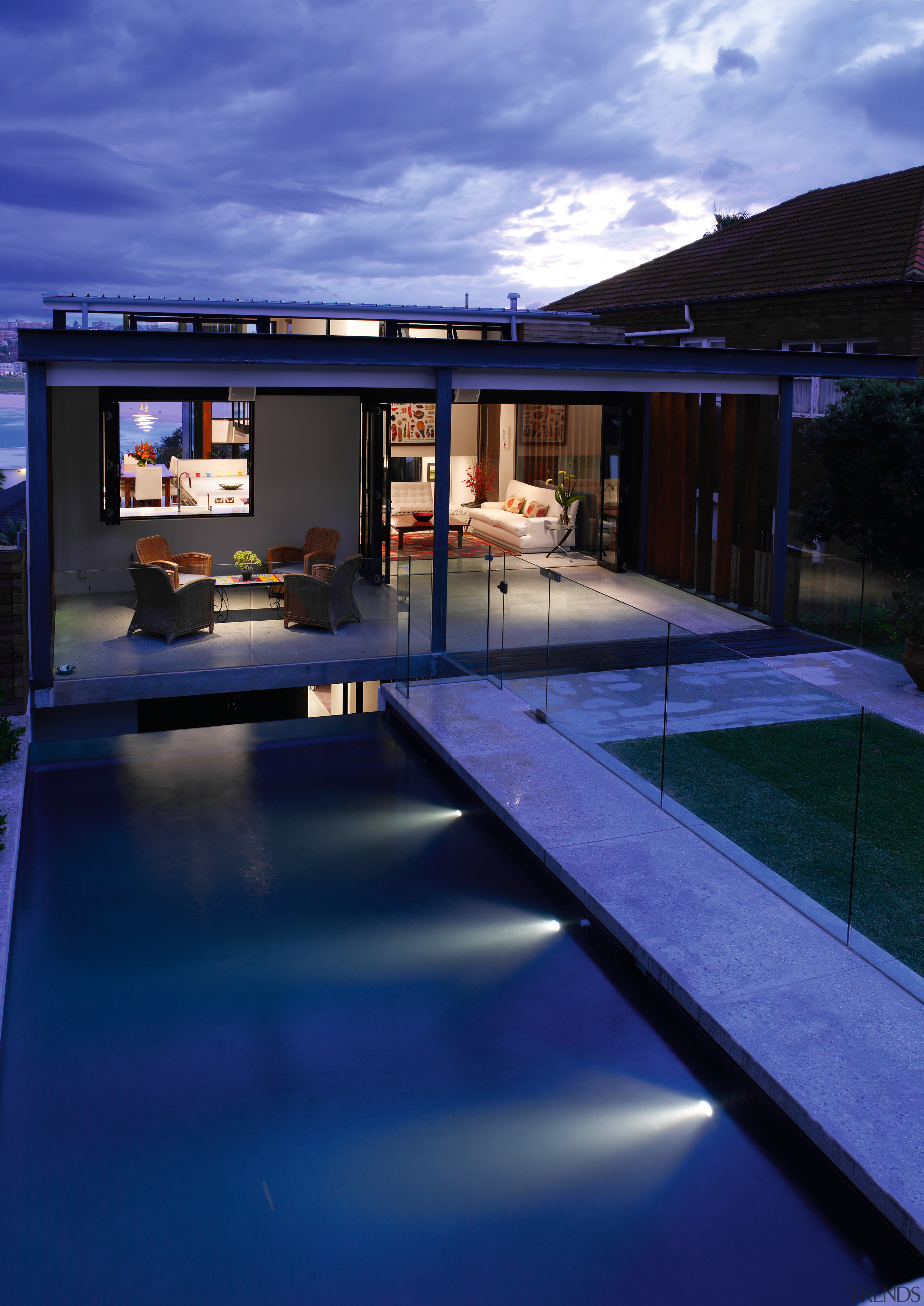 A view of the outdoor entertainment and pool architecture, daylighting, estate, facade, home, house, lighting, property, real estate, reflection, sky, swimming pool, window, blue