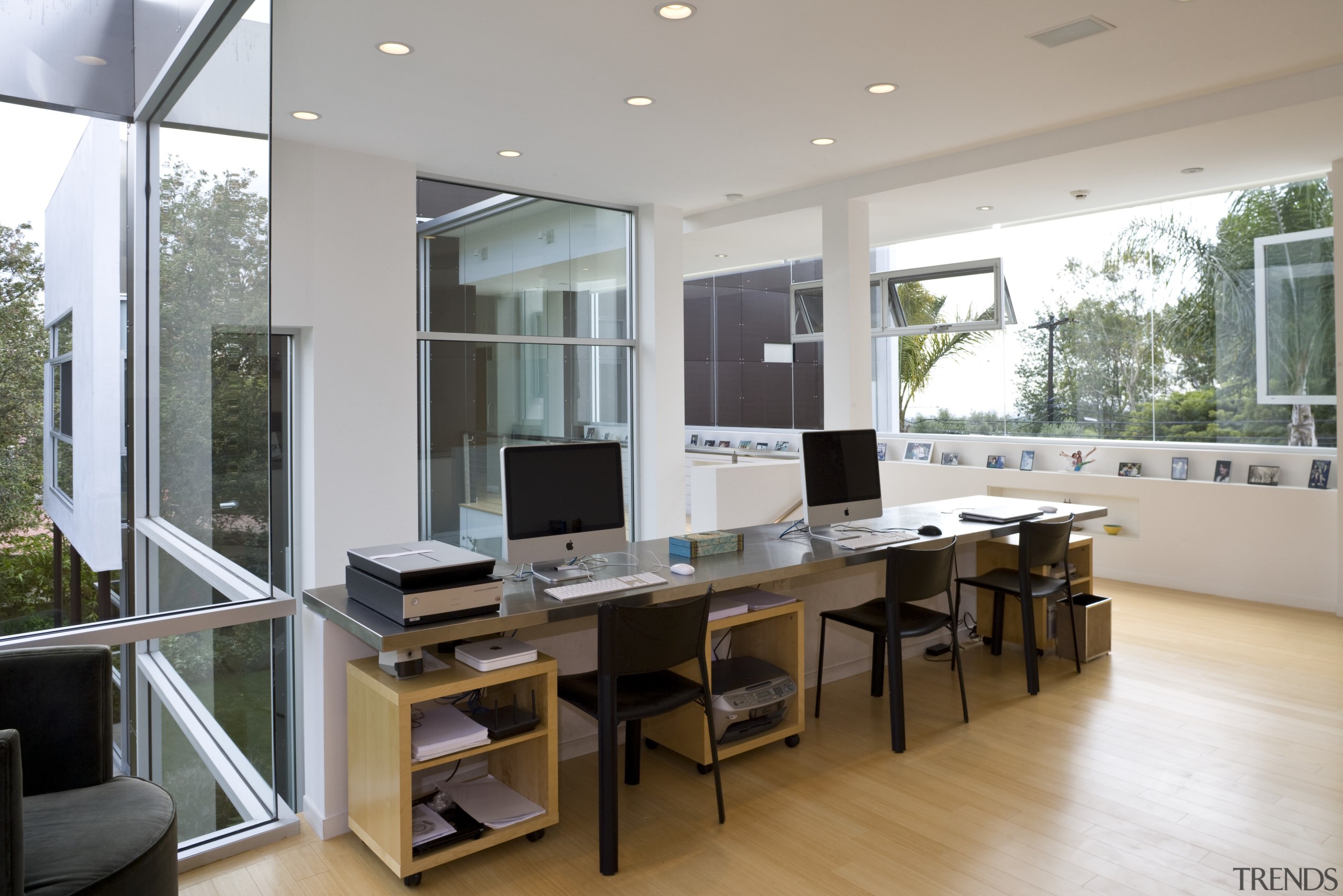 View of the study area which features office furniture, interior design, office, real estate, table, window, gray