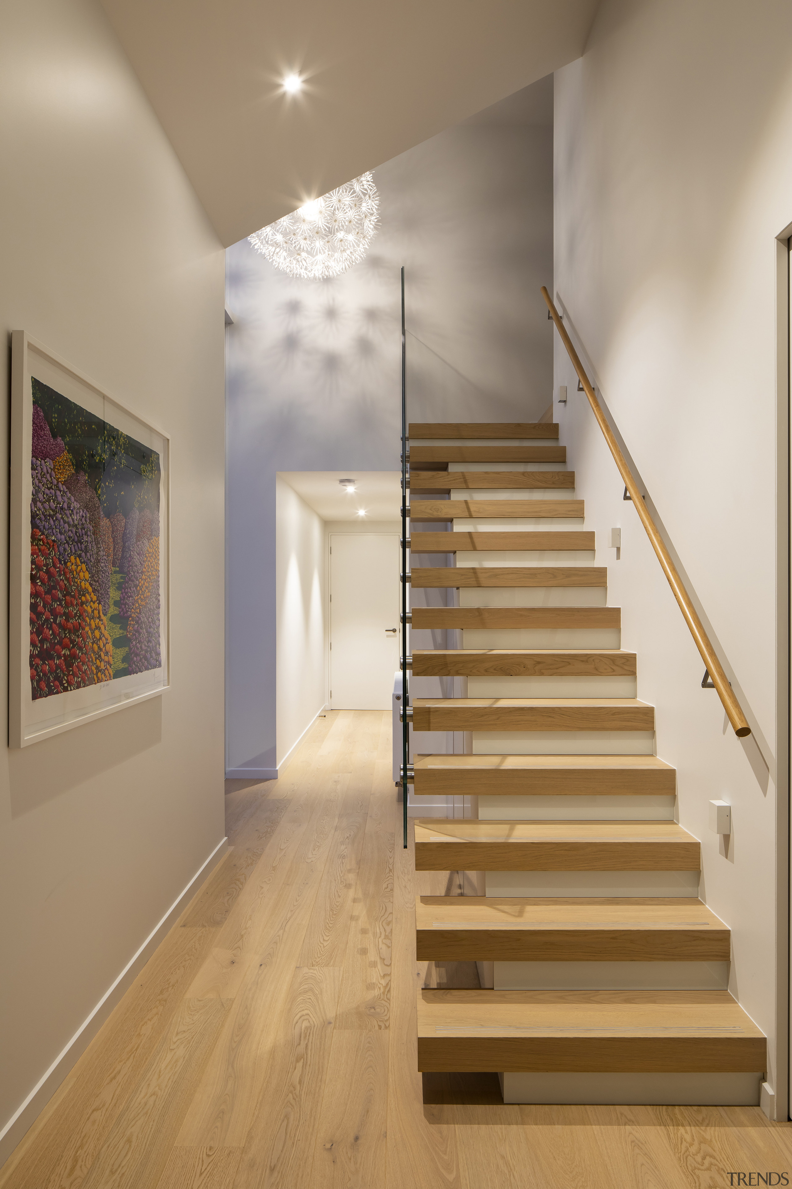 Stairs lead up the first floor master suite 