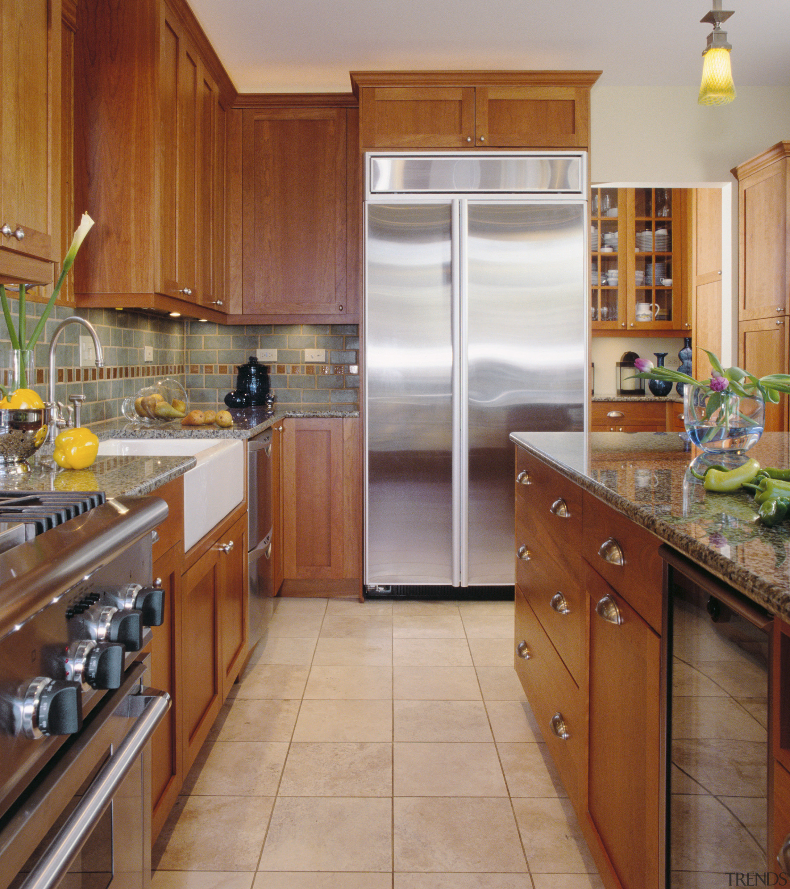 A vioew of this Kitchen designed by Community cabinetry, countertop, cuisine classique, flooring, hardwood, interior design, kitchen, real estate, room, brown, gray