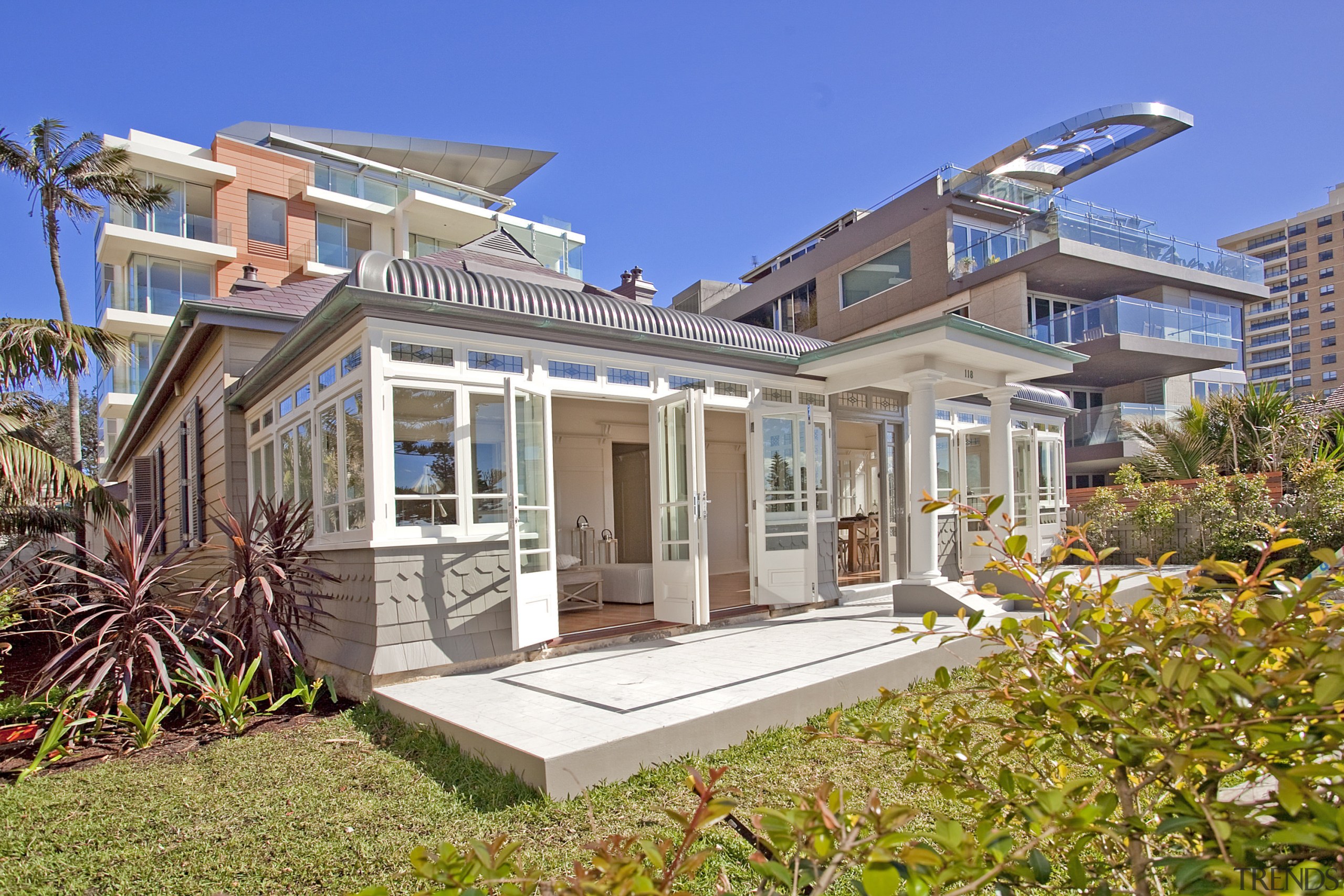 View of beachfront house with courtyard, formal living cottage, elevation, estate, facade, home, house, mixed use, property, real estate, residential area, villa, gray