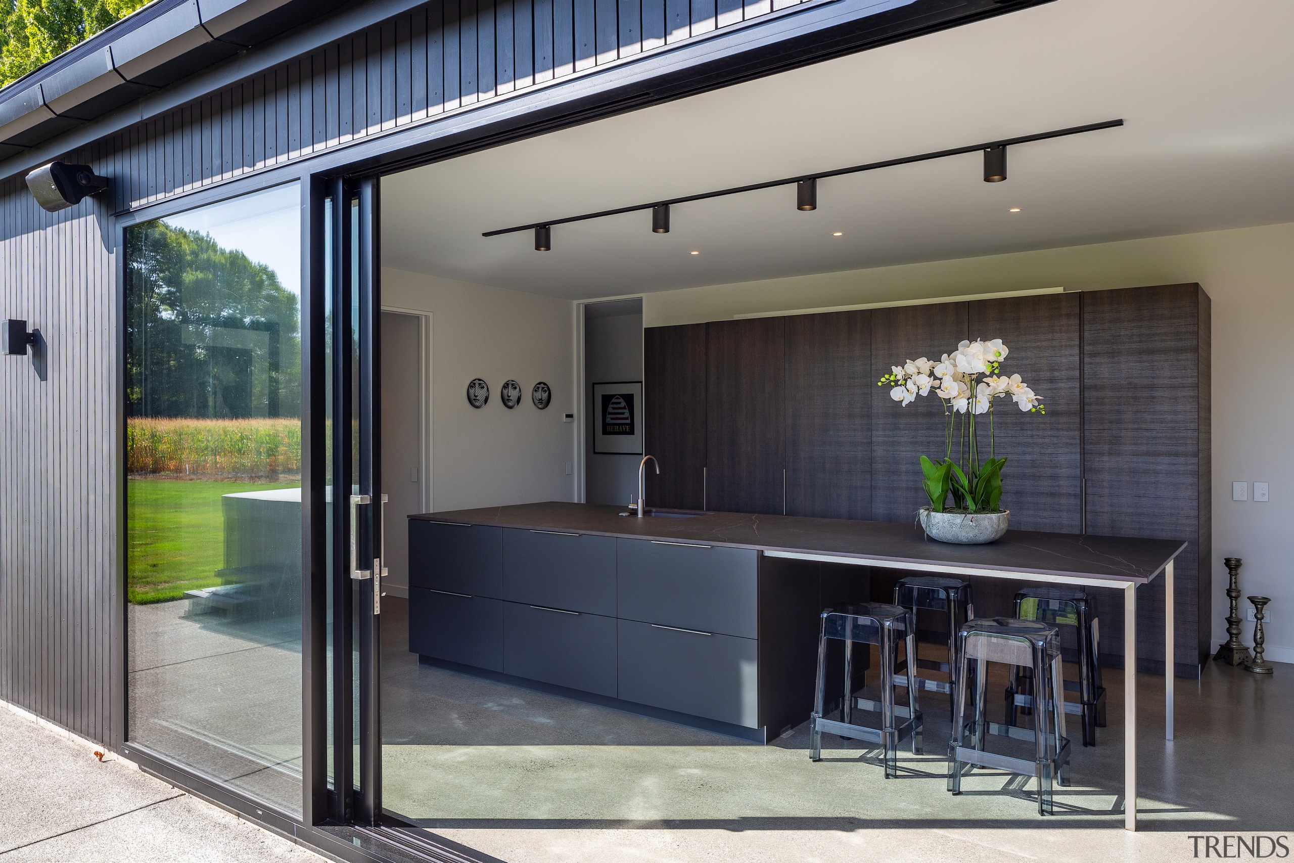 The kitchen teams nicely with the home's dark 