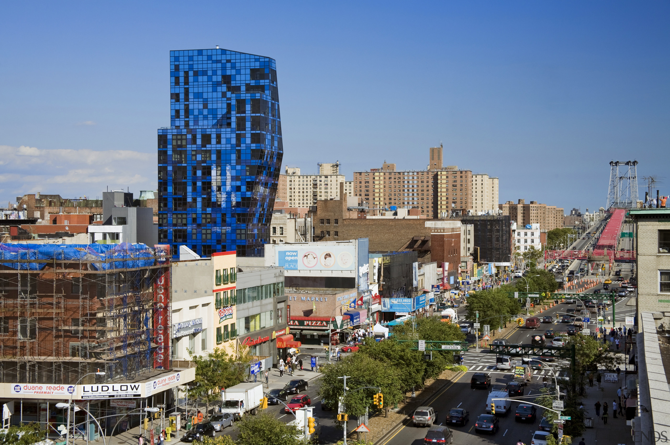 Four shades of blue glass were used to building, city, cityscape, condominium, daytime, downtown, landmark, metropolis, metropolitan area, mixed use, neighbourhood, plaza, real estate, residential area, sky, skyline, skyscraper, tower, tower block, town, tree, urban area, teal