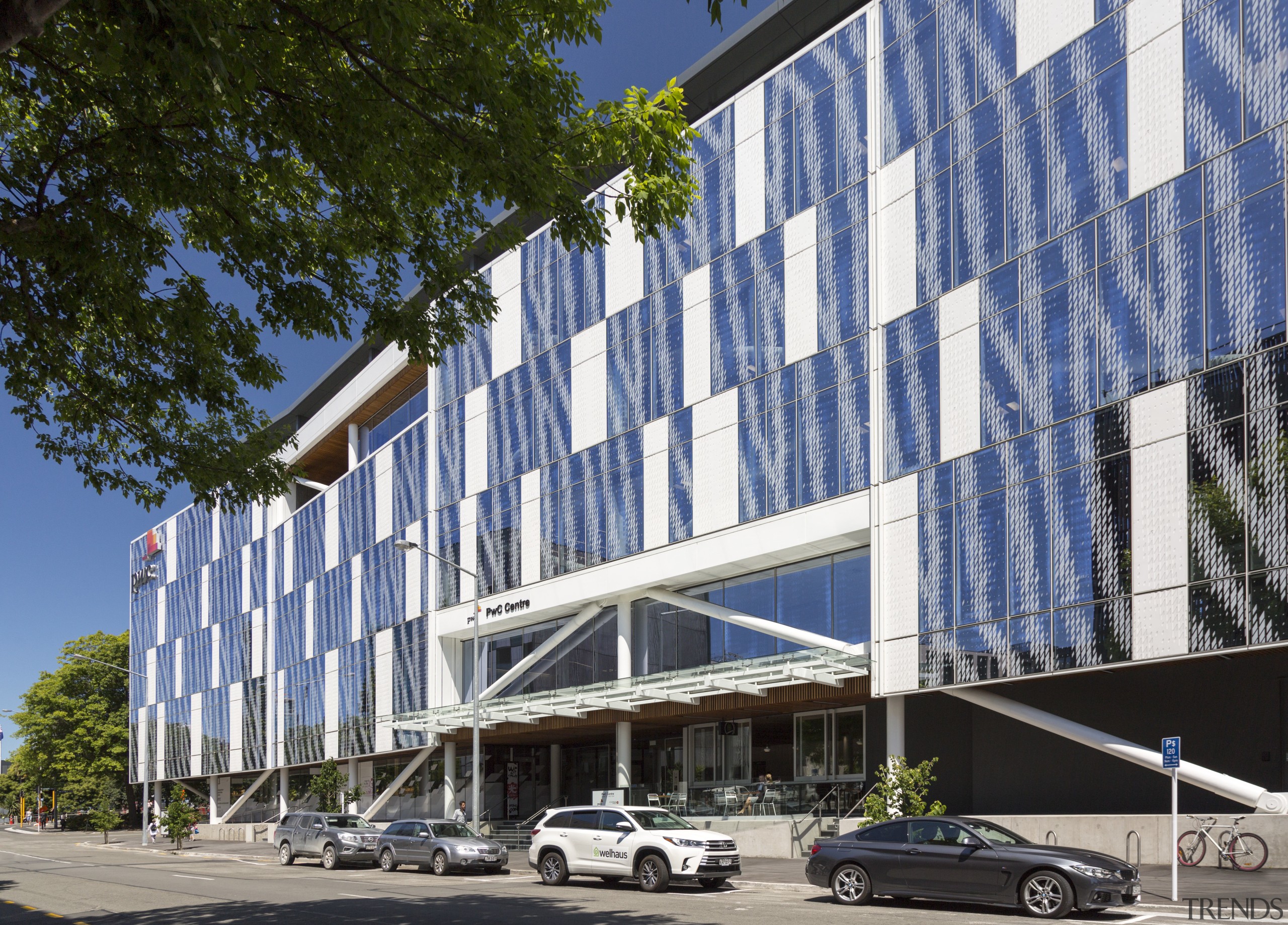 A double-height atrium greets visitors to the PwC apartment, architecture, building, commercial building, condominium, corporate headquarters, daytime, facade, headquarters, house, metropolitan area, mixed use, neighbourhood, real estate, residential area