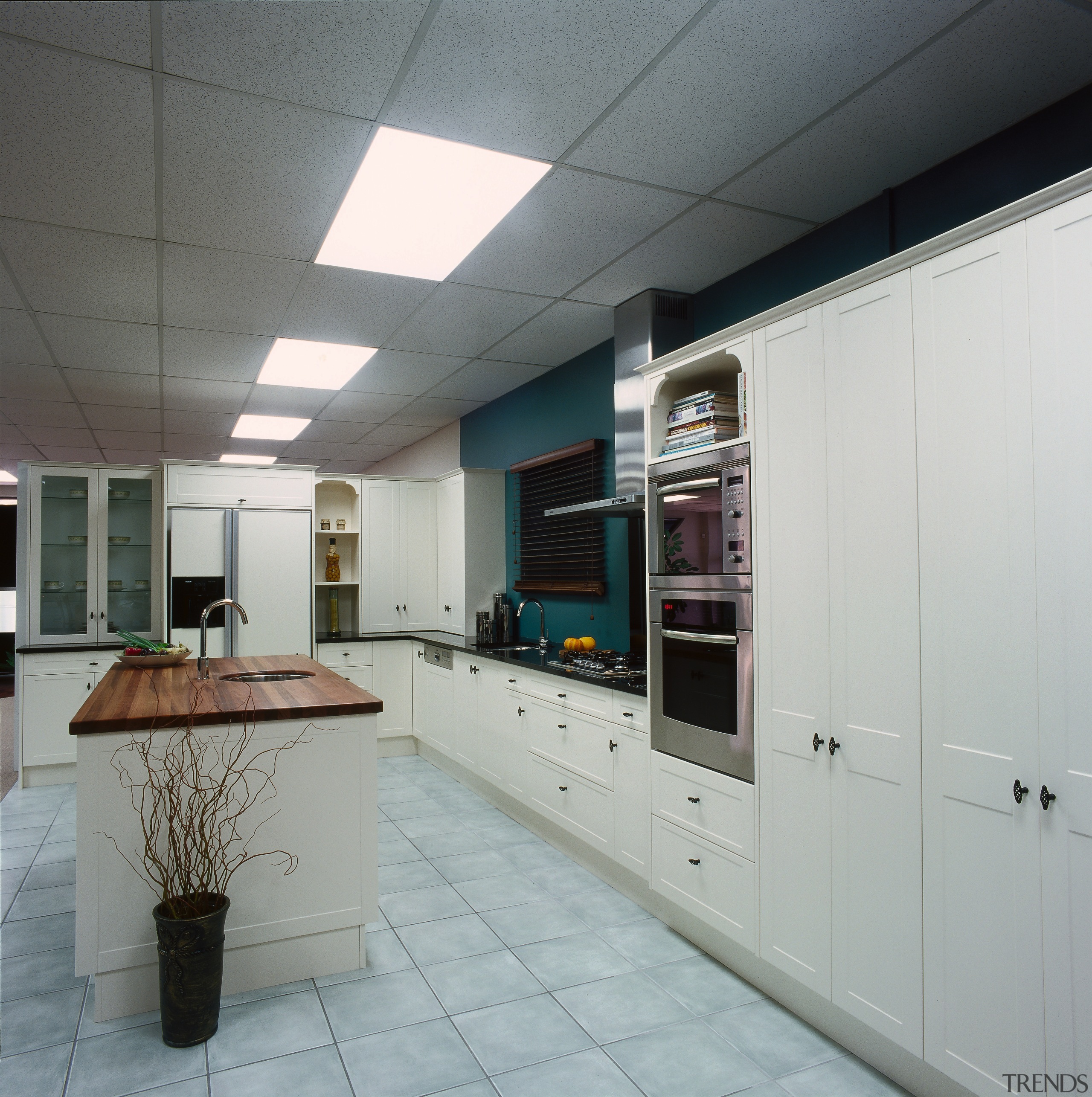 Showroom kitchen with white cabinetry, black benchtops, timber ceiling, countertop, interior design, kitchen, gray