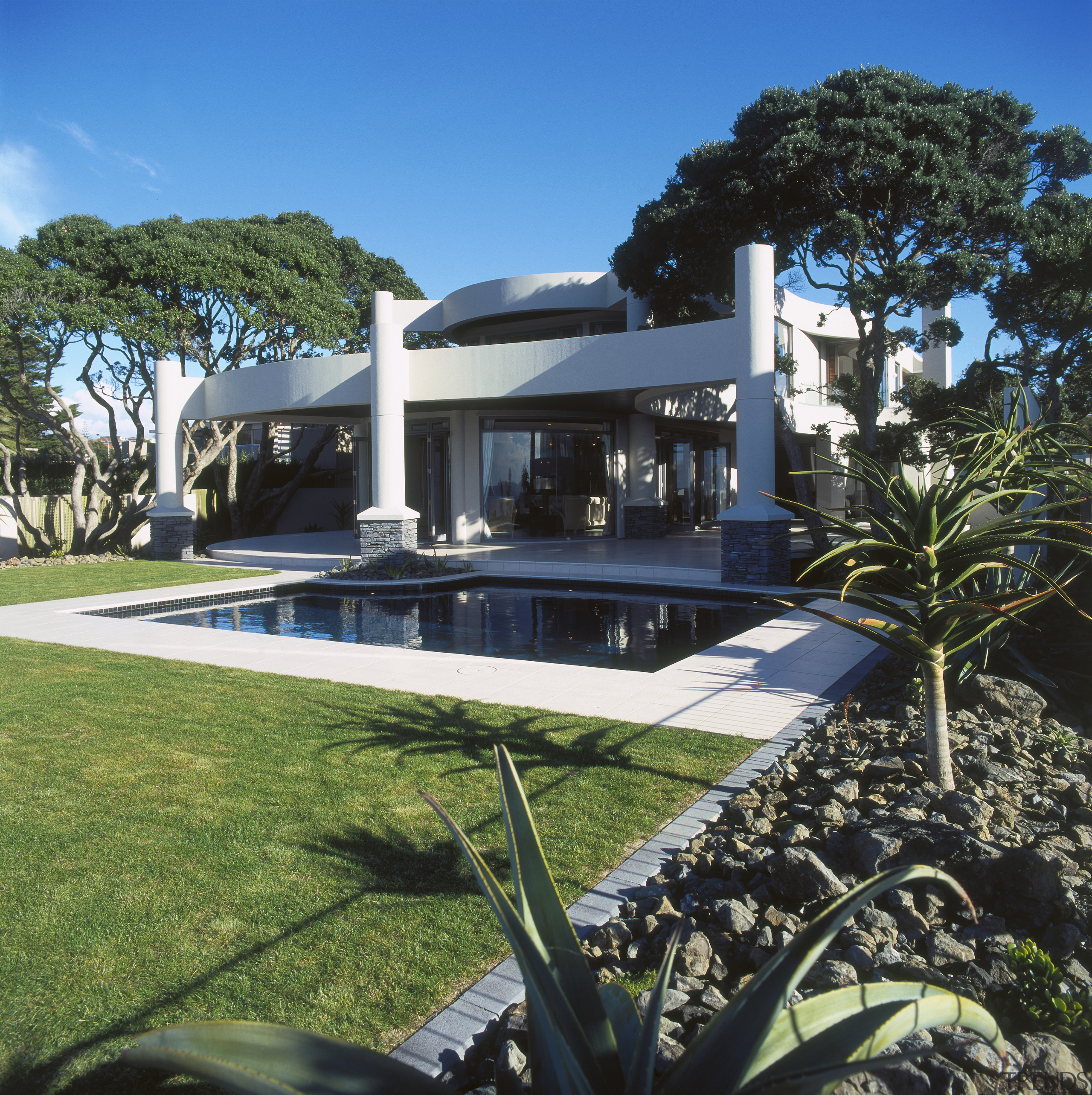 exterior view of house designed by Don Nelson architecture, arecales, estate, home, house, mansion, palm tree, property, real estate, resort, swimming pool, villa, black