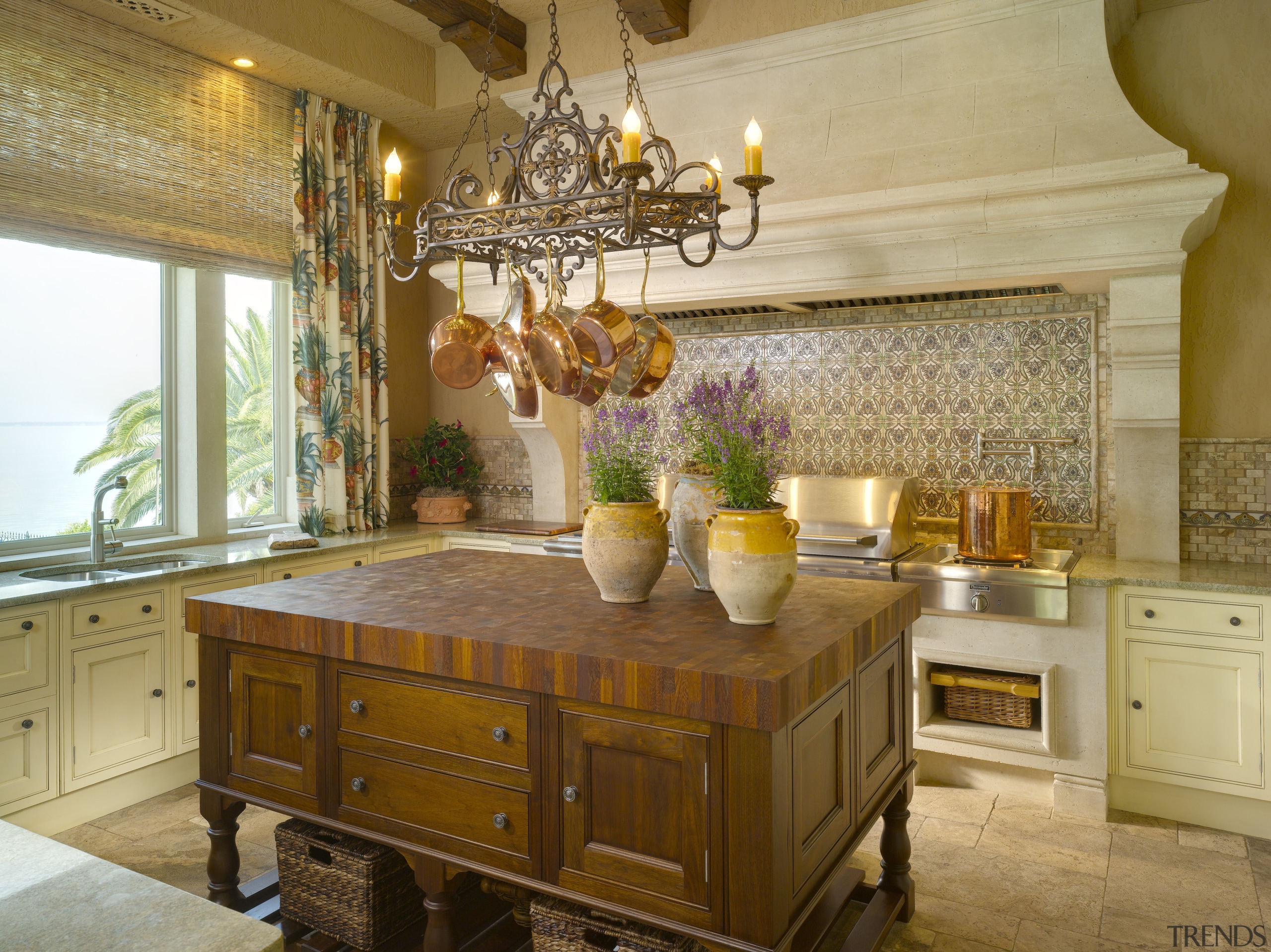 View of a traditional-styled kitchen which features a cabinetry, countertop, cuisine classique, home, interior design, kitchen, room, brown, orange