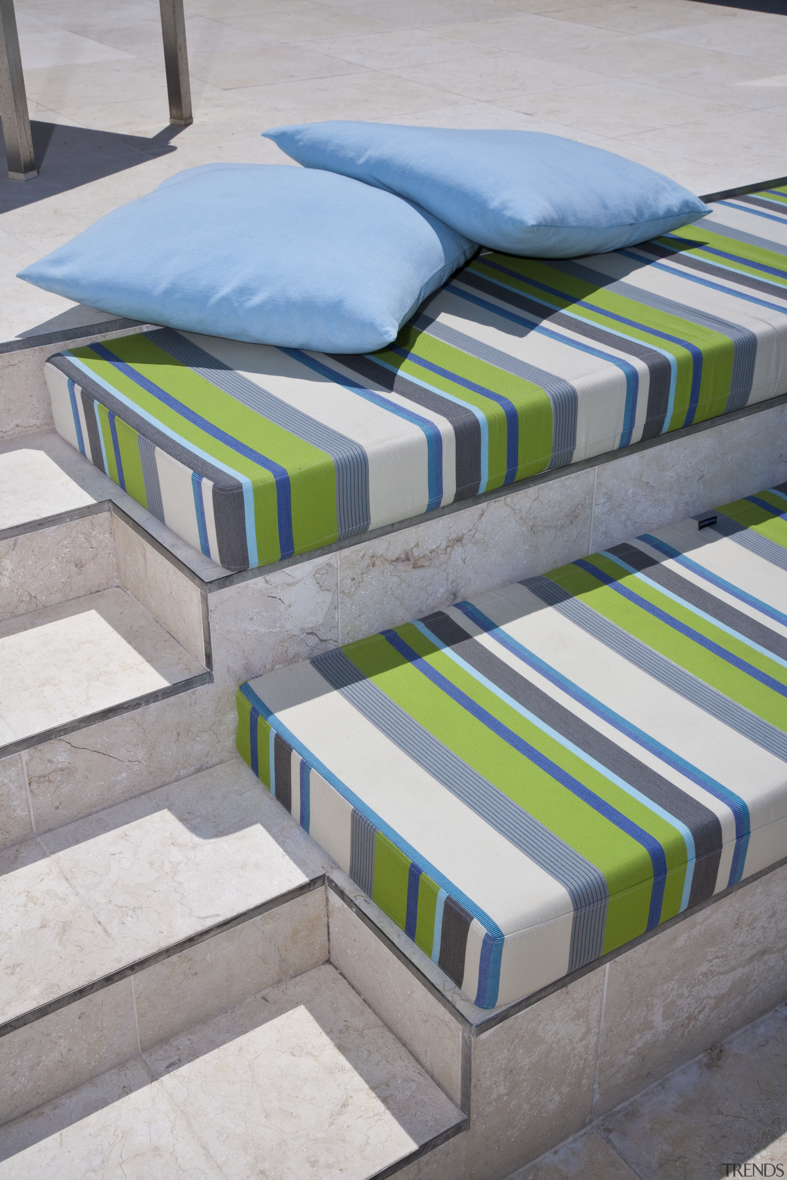 View of rooftop terrace which features paving, outdoor bed, bed sheet, furniture, material, mattress, product, product design, textile, gray