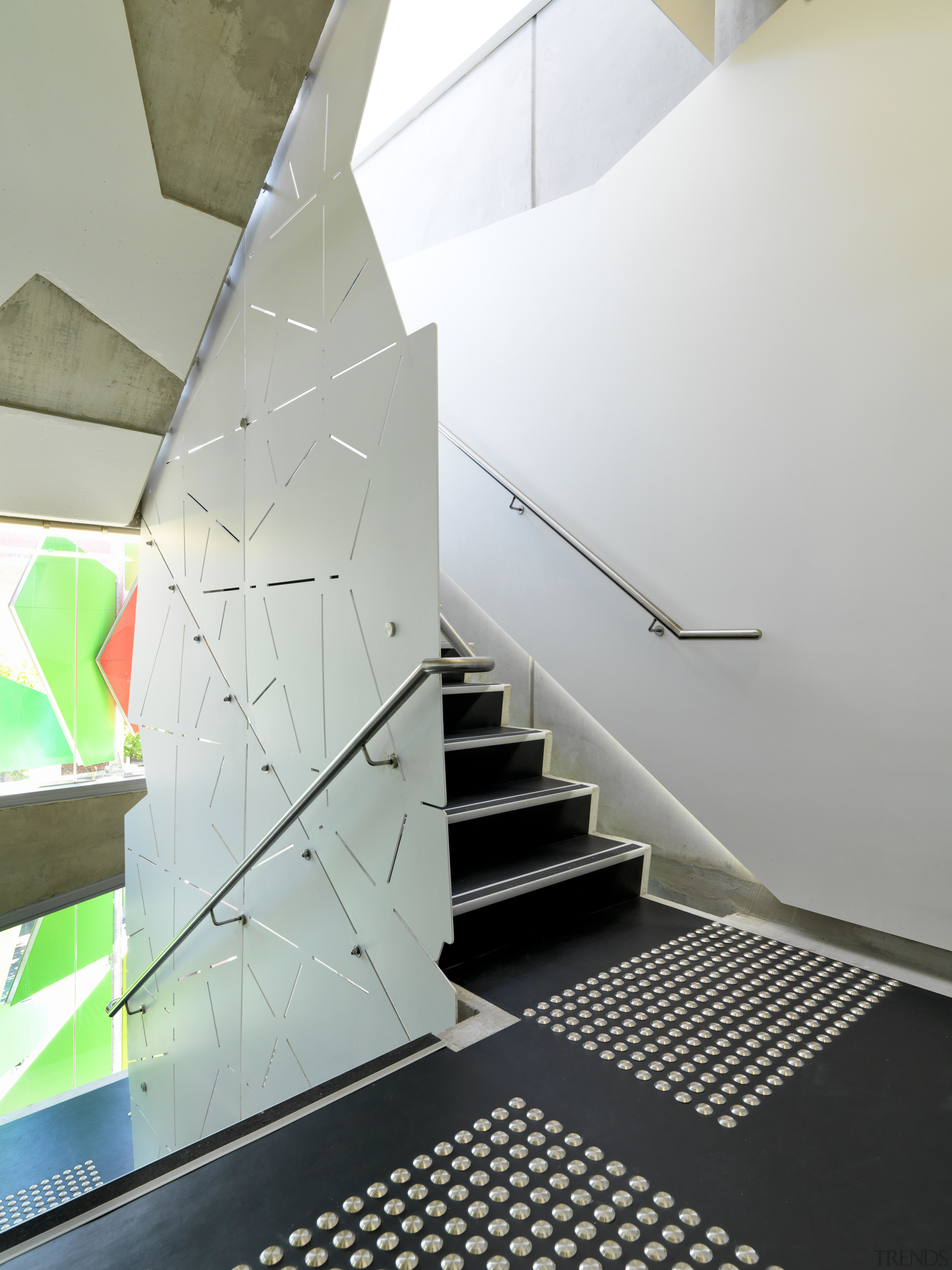 View of Pixel Building, with colorful exterior flags, angle, architecture, ceiling, daylighting, design, floor, glass, handrail, house, interior design, product design, stairs, gray