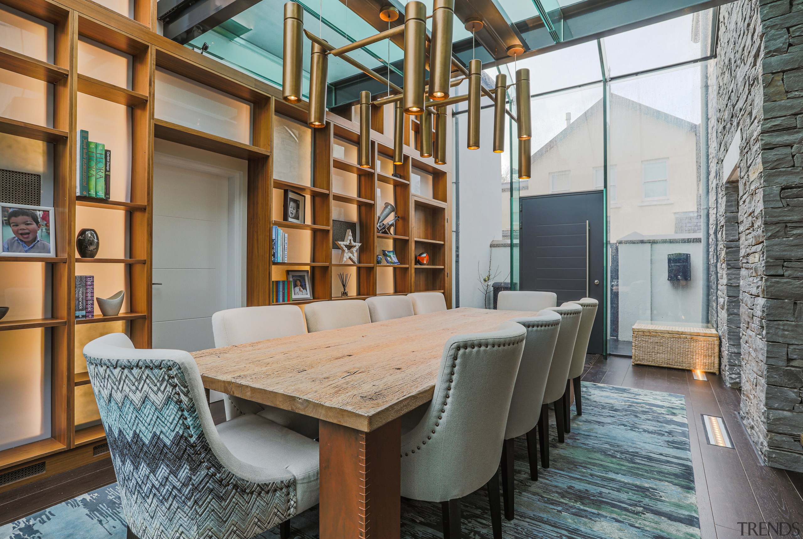 A large custom shelving unit adorns one side 