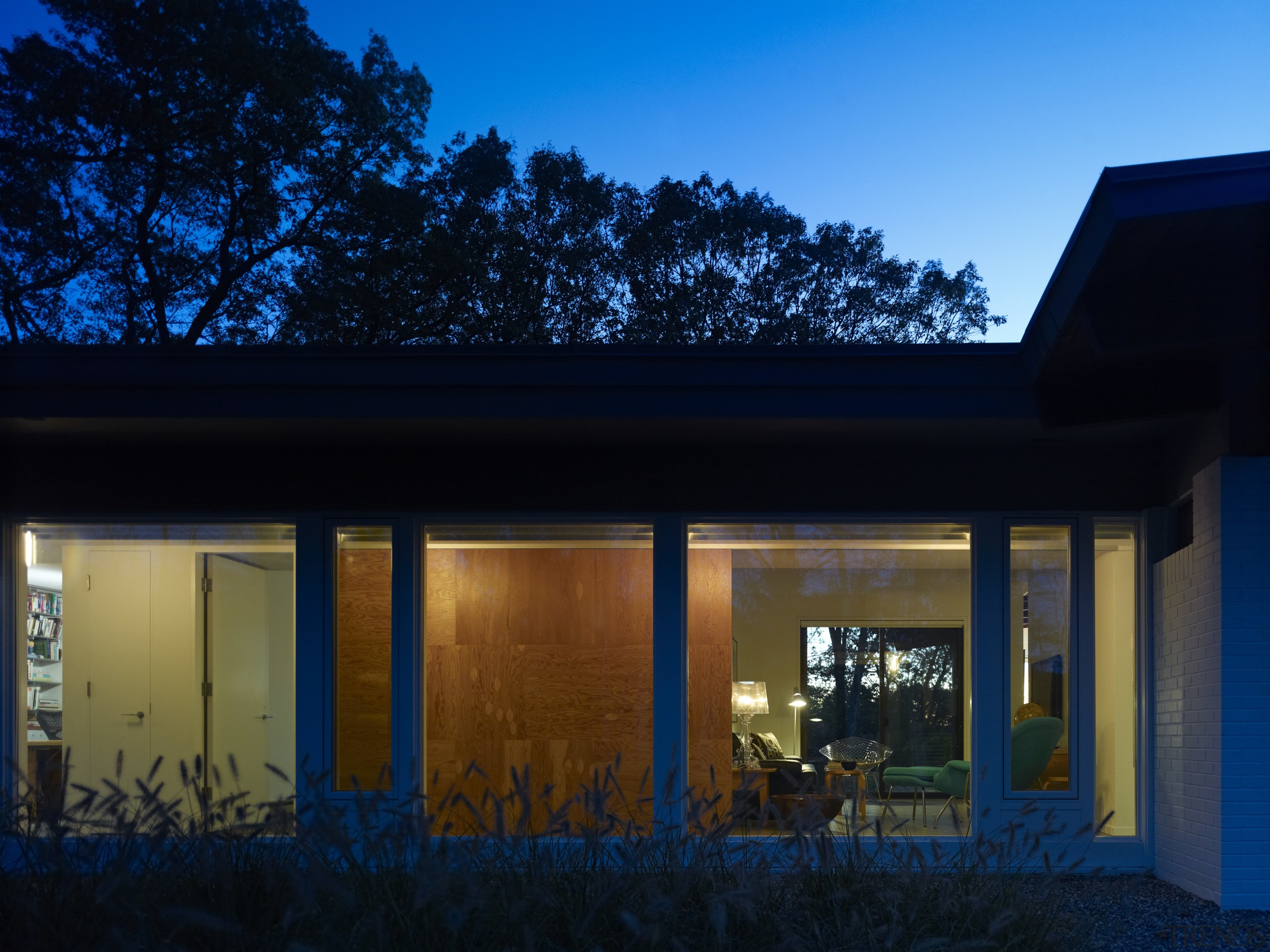 updated this 1960s house for his own familys architecture, blue, cottage, evening, facade, home, house, light, lighting, night, real estate, residential area, roof, sky, sunlight, window, black