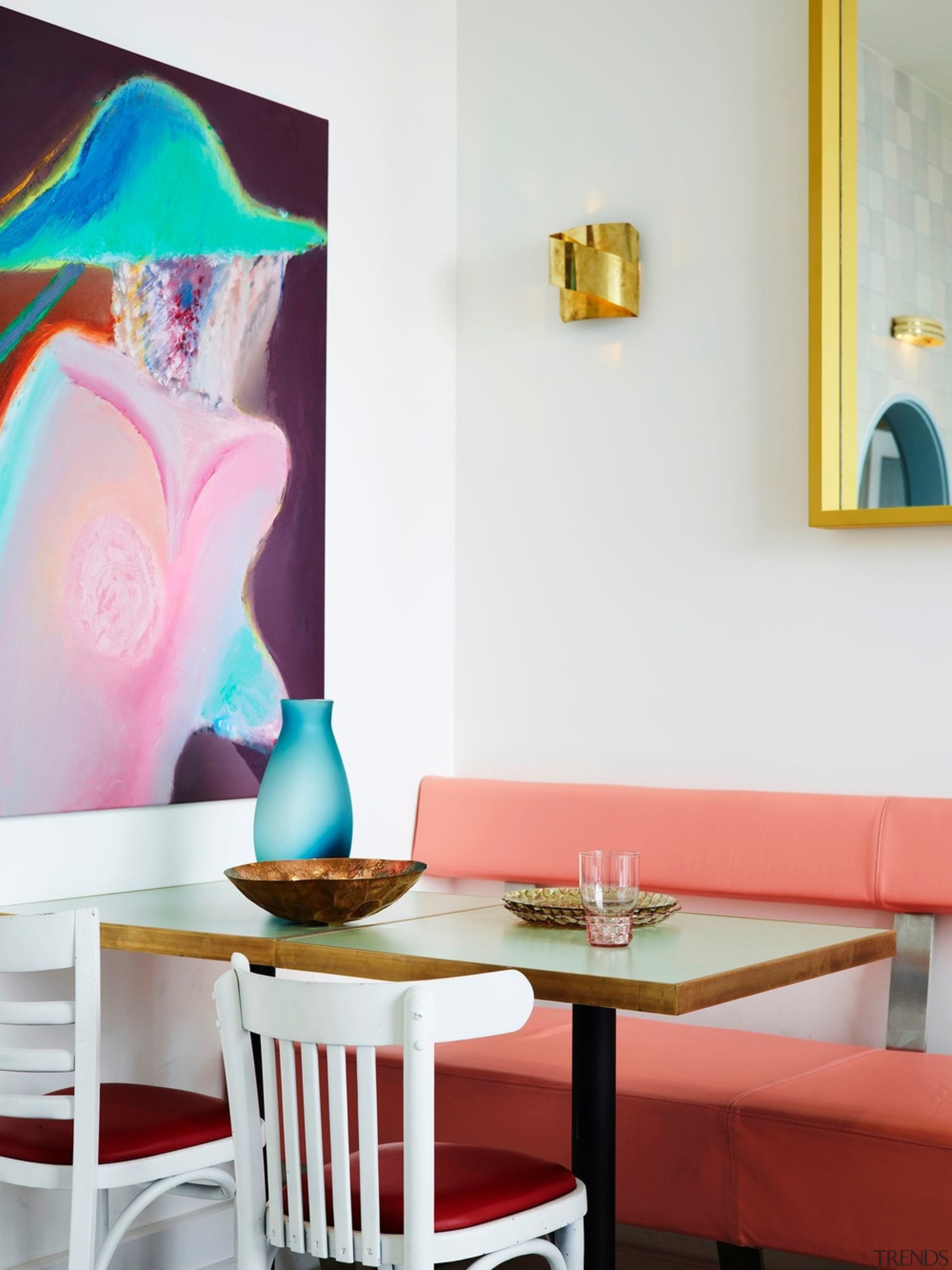 The colour scheme is big and camp, with chair, furniture, home, interior design, lampshade, lighting accessory, living room, pink, room, table, wall, white