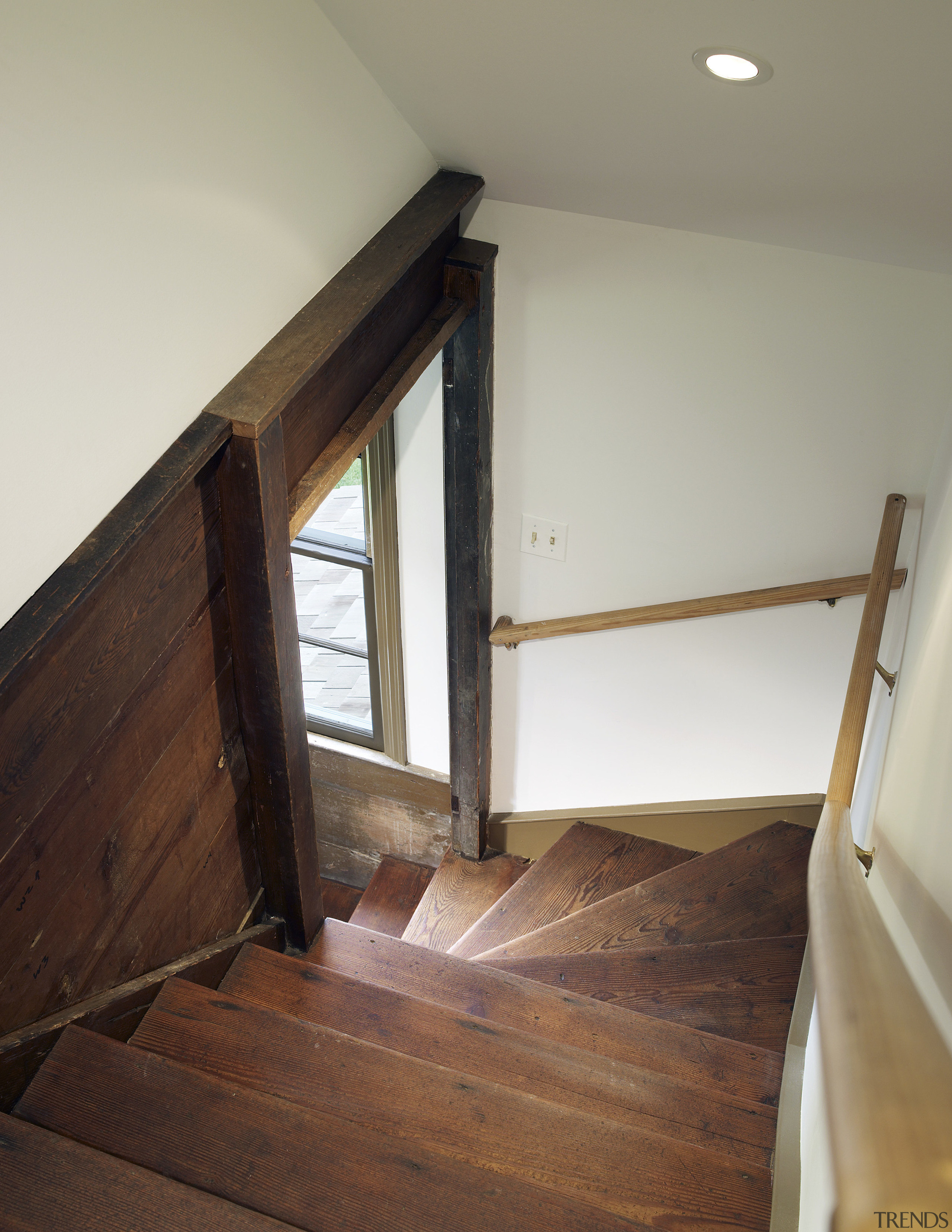 This home was built by Tom Glass of daylighting, floor, flooring, handrail, hardwood, home, house, interior design, laminate flooring, property, real estate, room, stairs, wall, window, wood, wood flooring, wood stain, gray