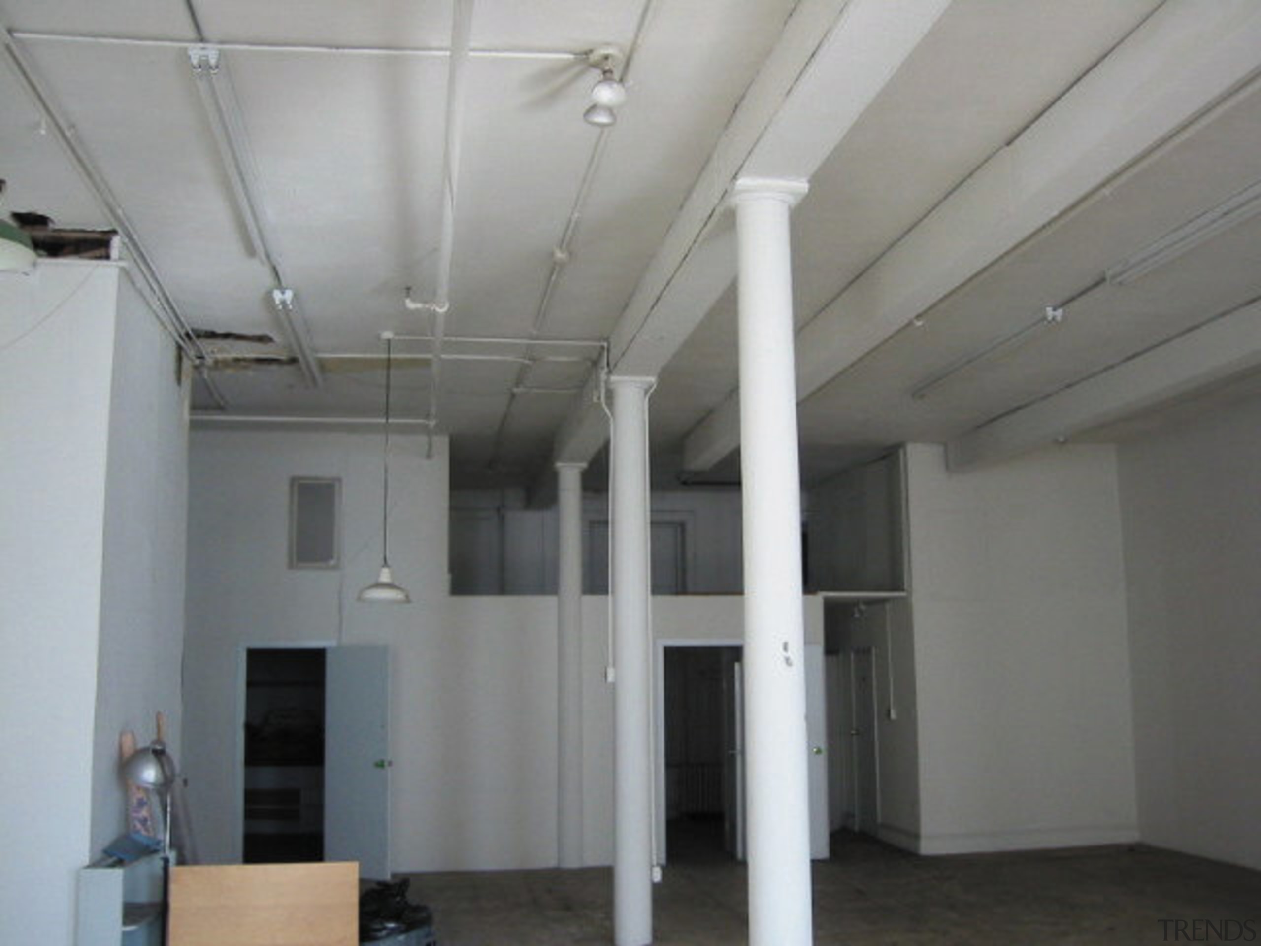 A view of the living area before it ceiling, daylighting, floor, real estate, roof, structure, gray