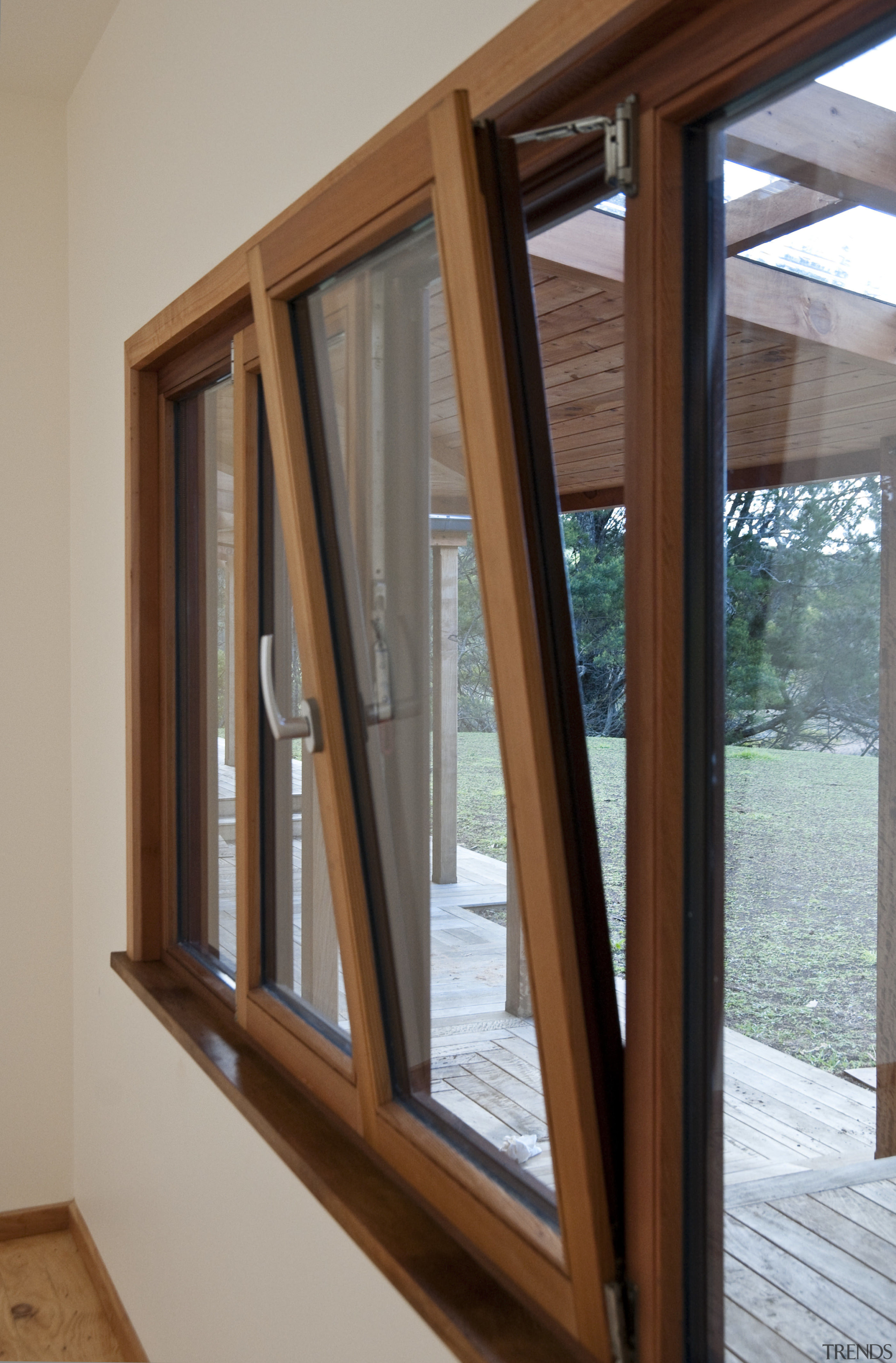 View of windows set into timber joinery by daylighting, door, sash window, window, wood, wood stain, gray