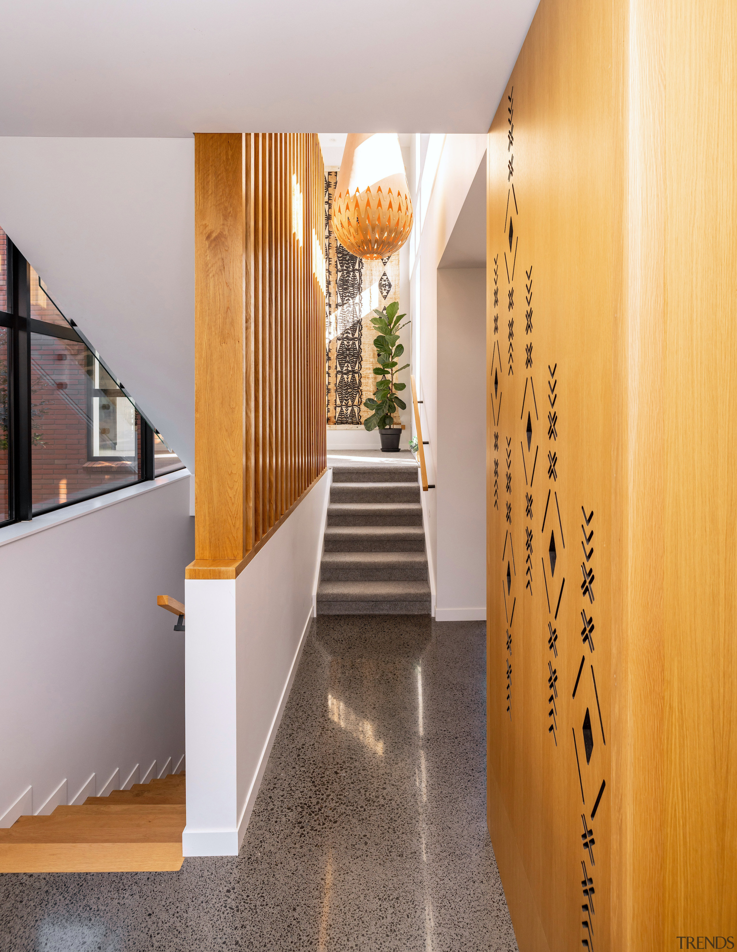 Circulation stairs that reveal interior spaces and courtyard 