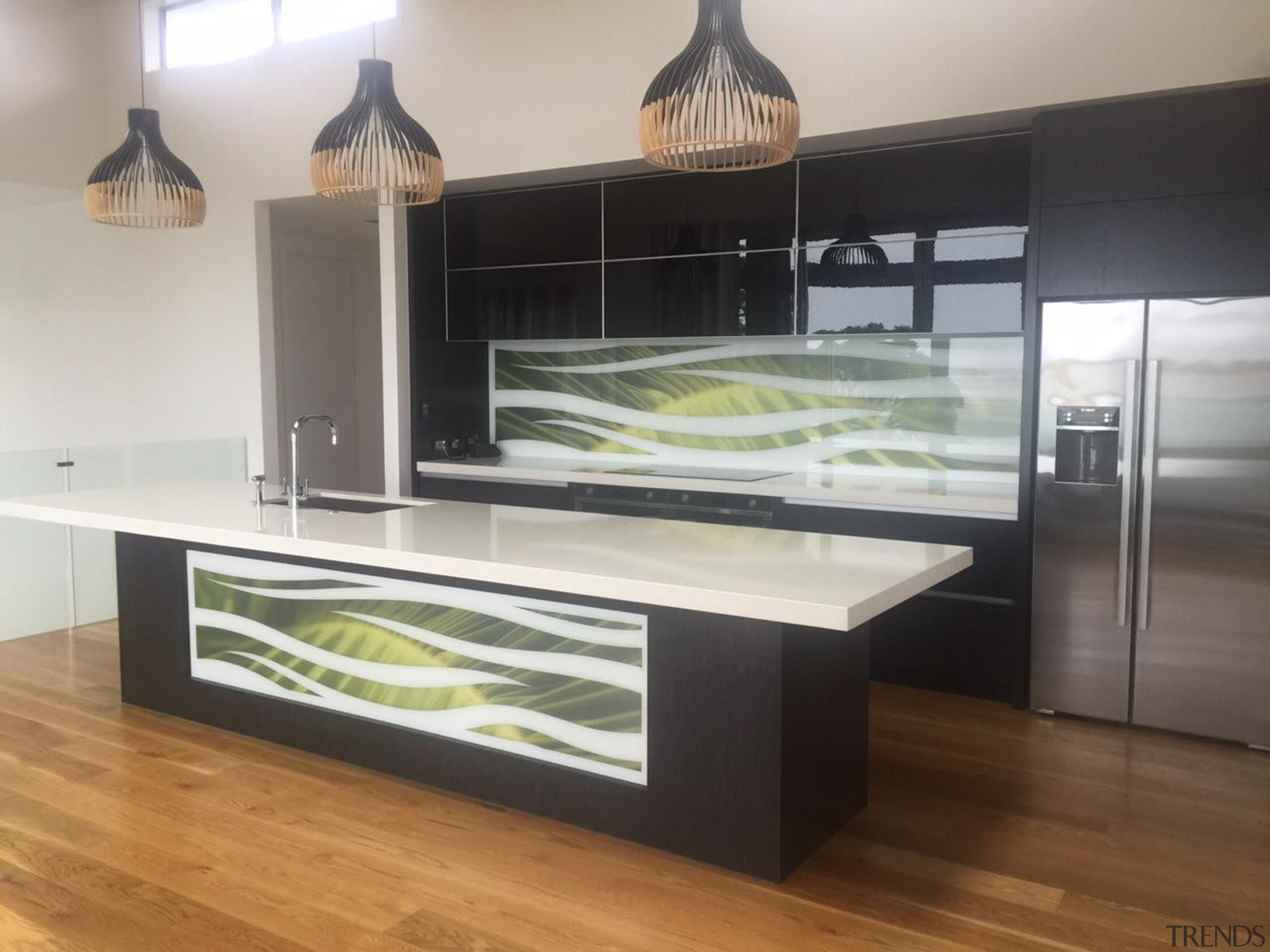 Colourful glass splashbacks create a dynamic backdrop in countertop, furniture, glass, kitchen, gray