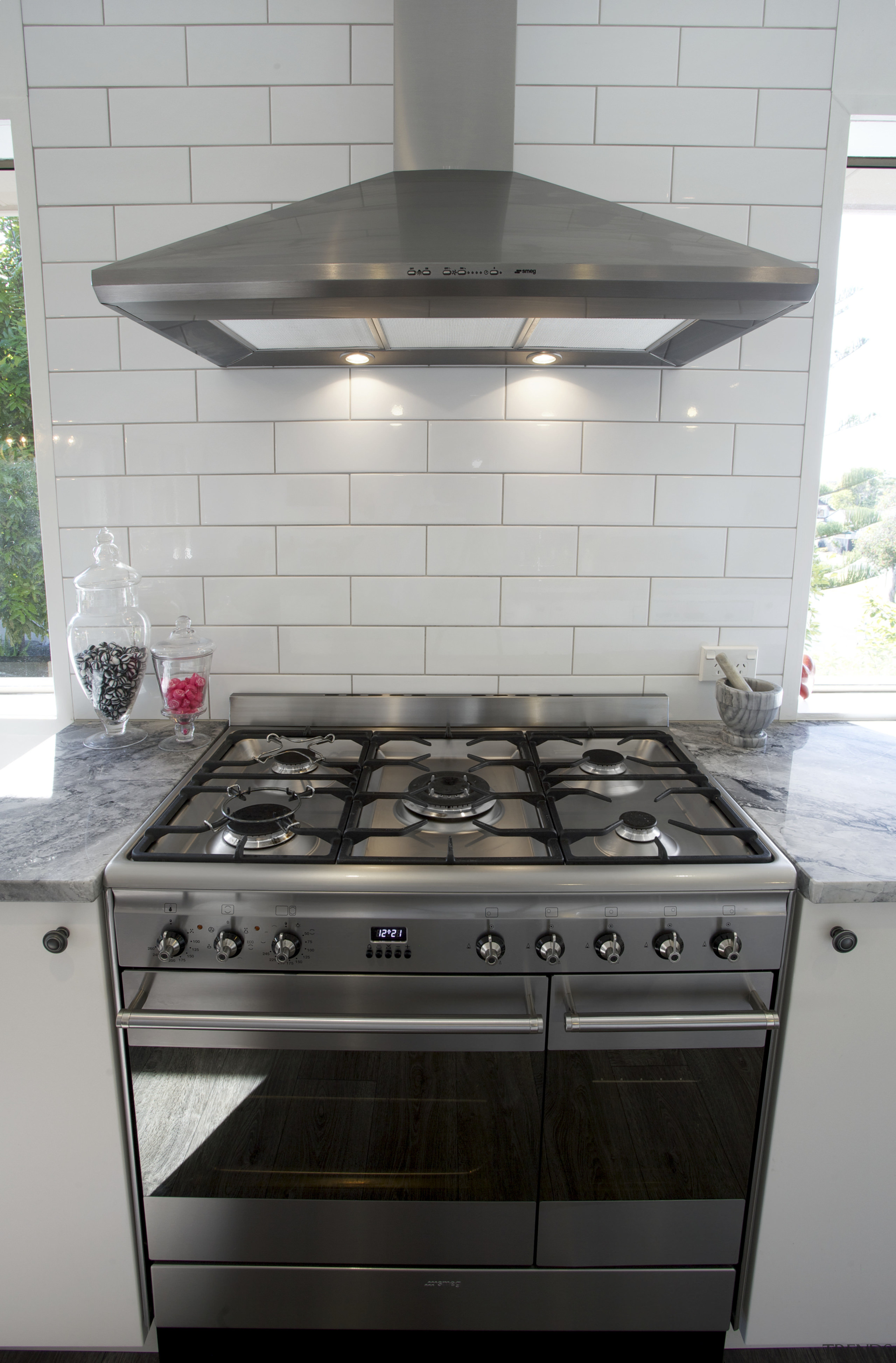 The owners chose a Smeg SUK92MX8 90cm range countertop, floor, flooring, gas stove, home appliance, kitchen, kitchen appliance, kitchen stove, major appliance, oven, stove, tile, gray