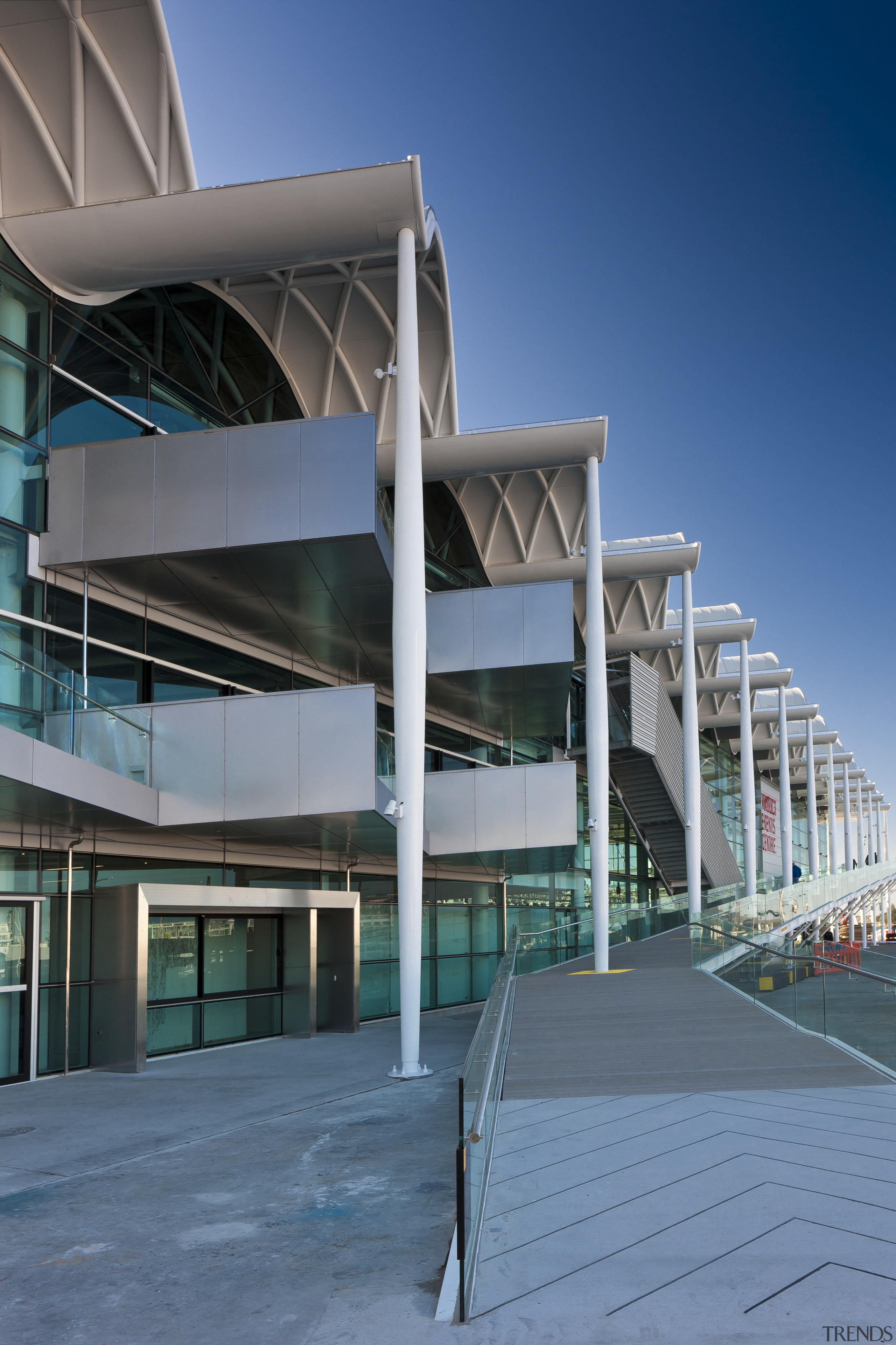 View of the Viaduct Events Center in Auckland's architecture, building, commercial building, condominium, corporate headquarters, daytime, facade, headquarters, metropolitan area, mixed use, sky, structure, teal