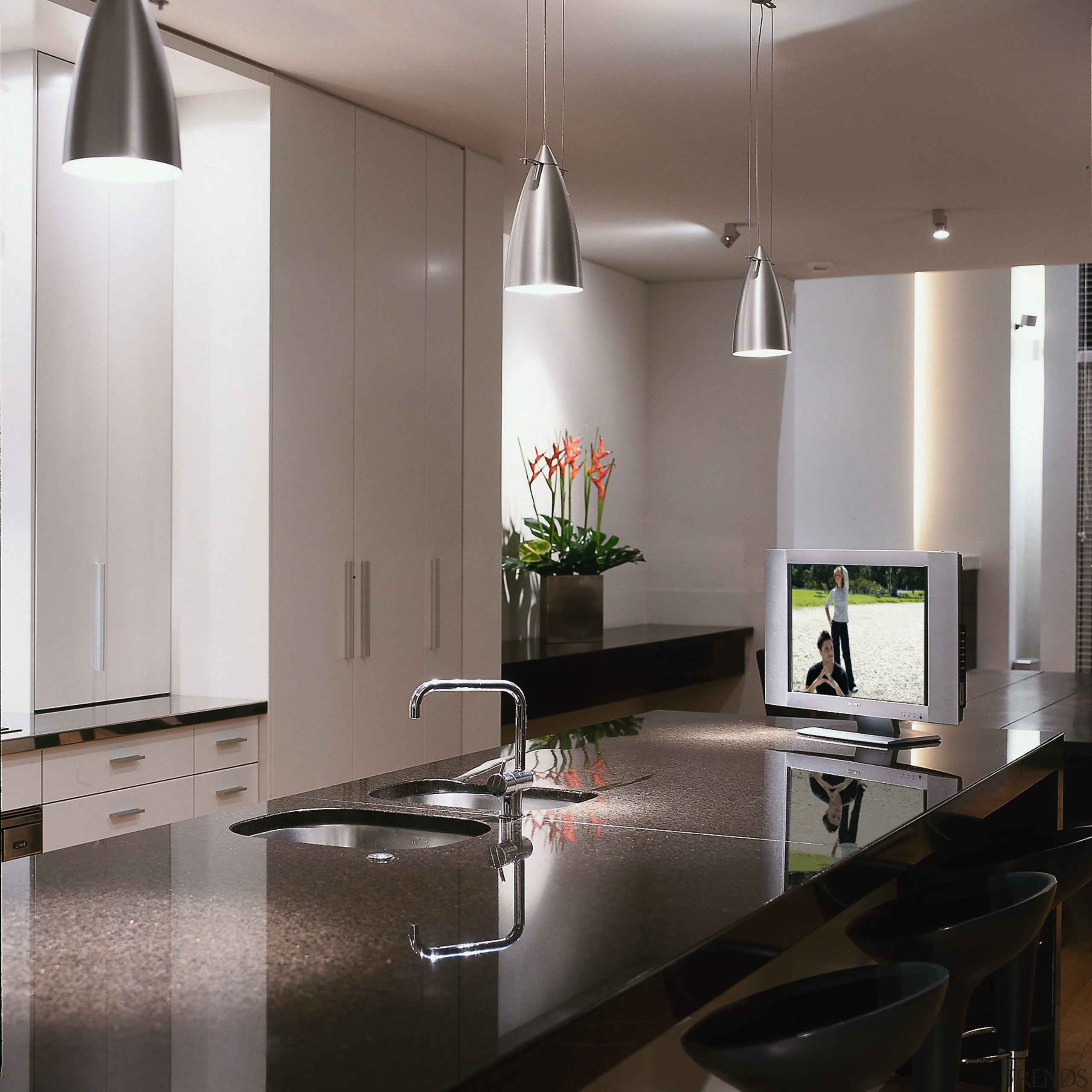 A photograph of a kitchen featuring a flat-screen countertop, floor, interior design, kitchen, gray