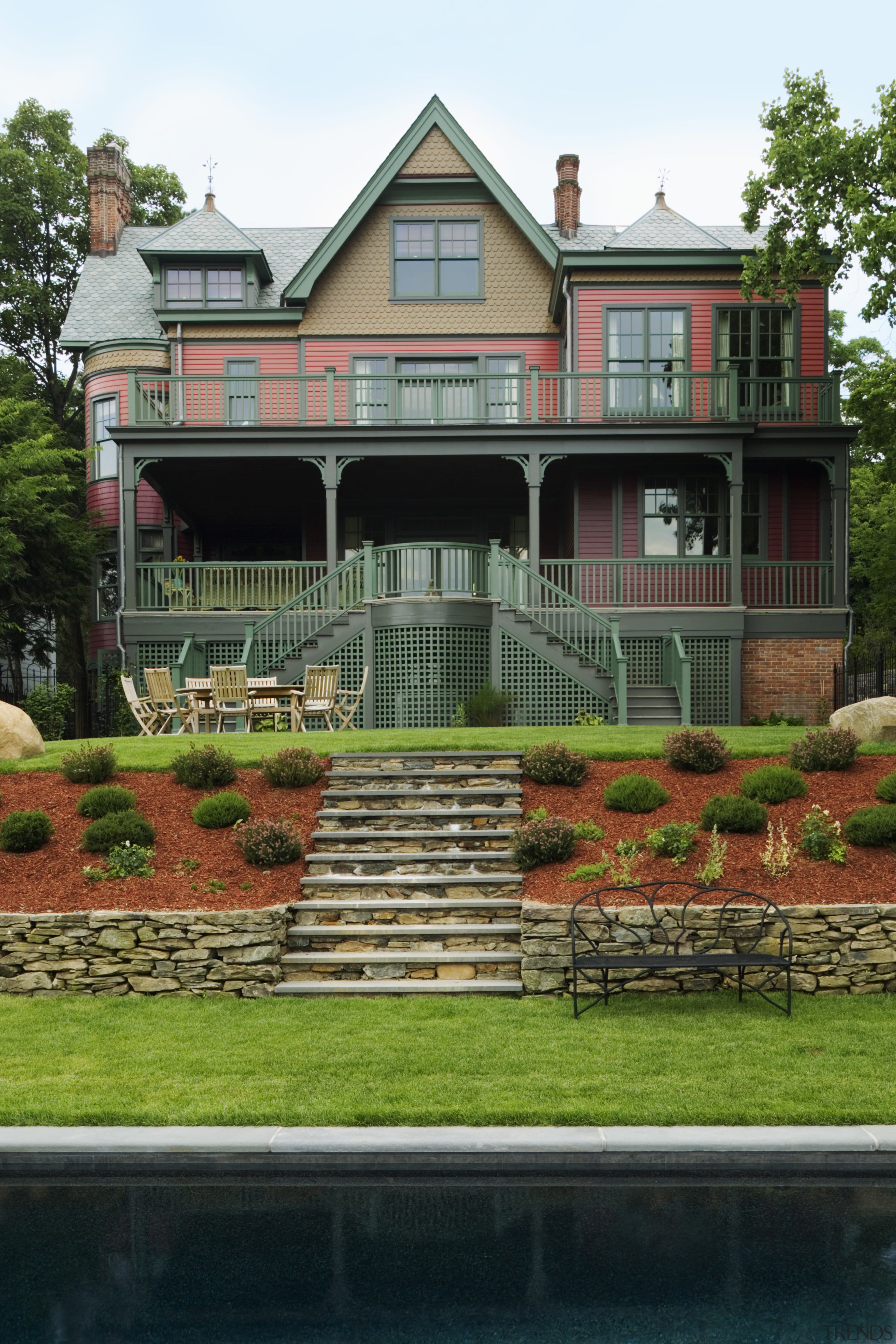 An exterior view of the entrance way to architecture, building, cottage, estate, facade, farmhouse, grass, historic house, home, house, landscaping, mansion, outdoor structure, property, real estate, reflection, residential area, villa