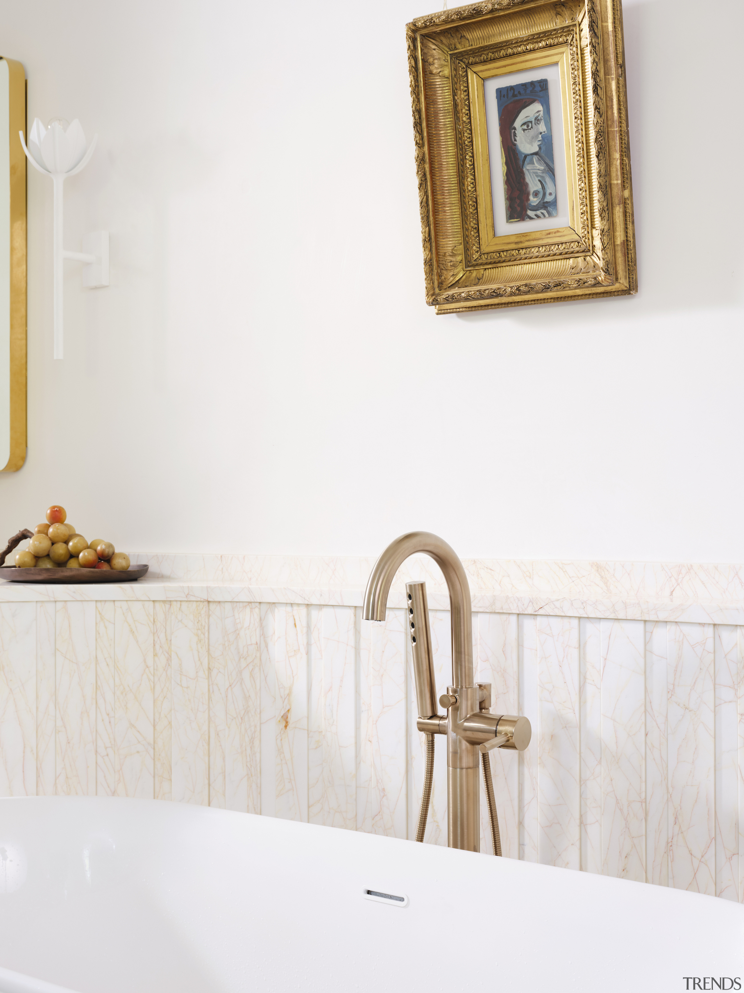 Gilded bath fixtures meet gilded painting frame. 