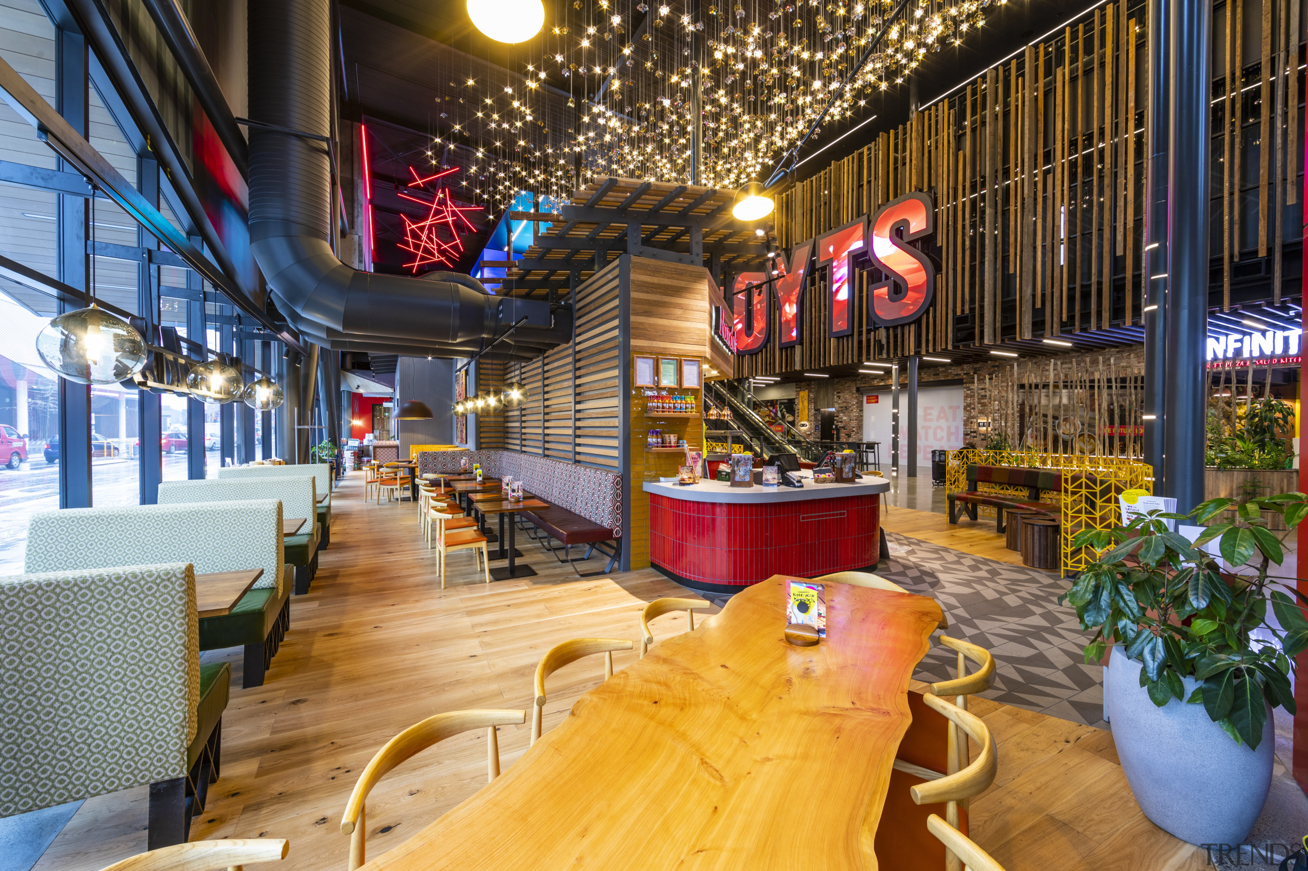 The soaring three-level atrium in the new EntX interior design, lobby, restaurant, brown