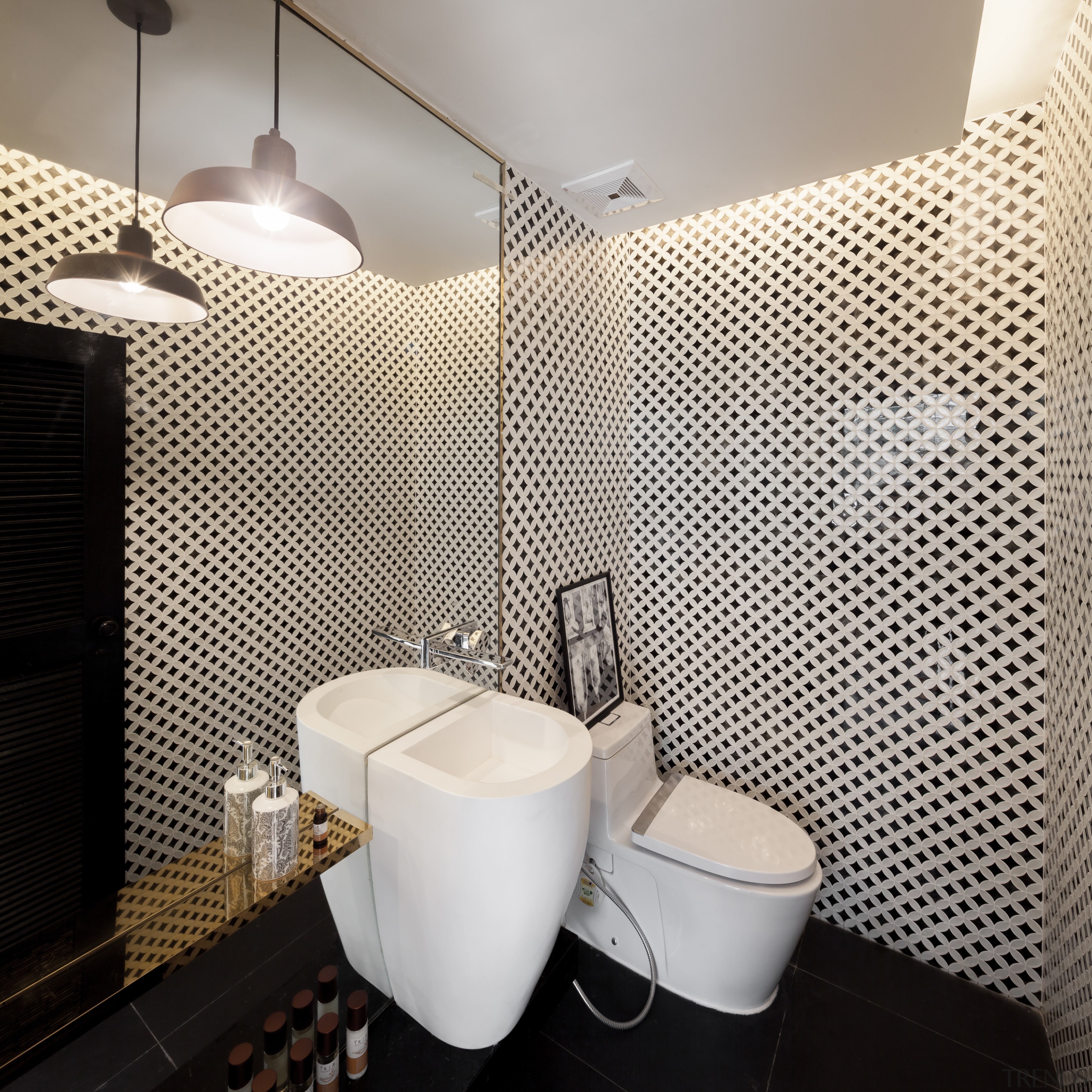 This eye-catching powder room is part of a bathroom, ceramic, flooring, interior design, toilet, basin, tile, renovated bathroom