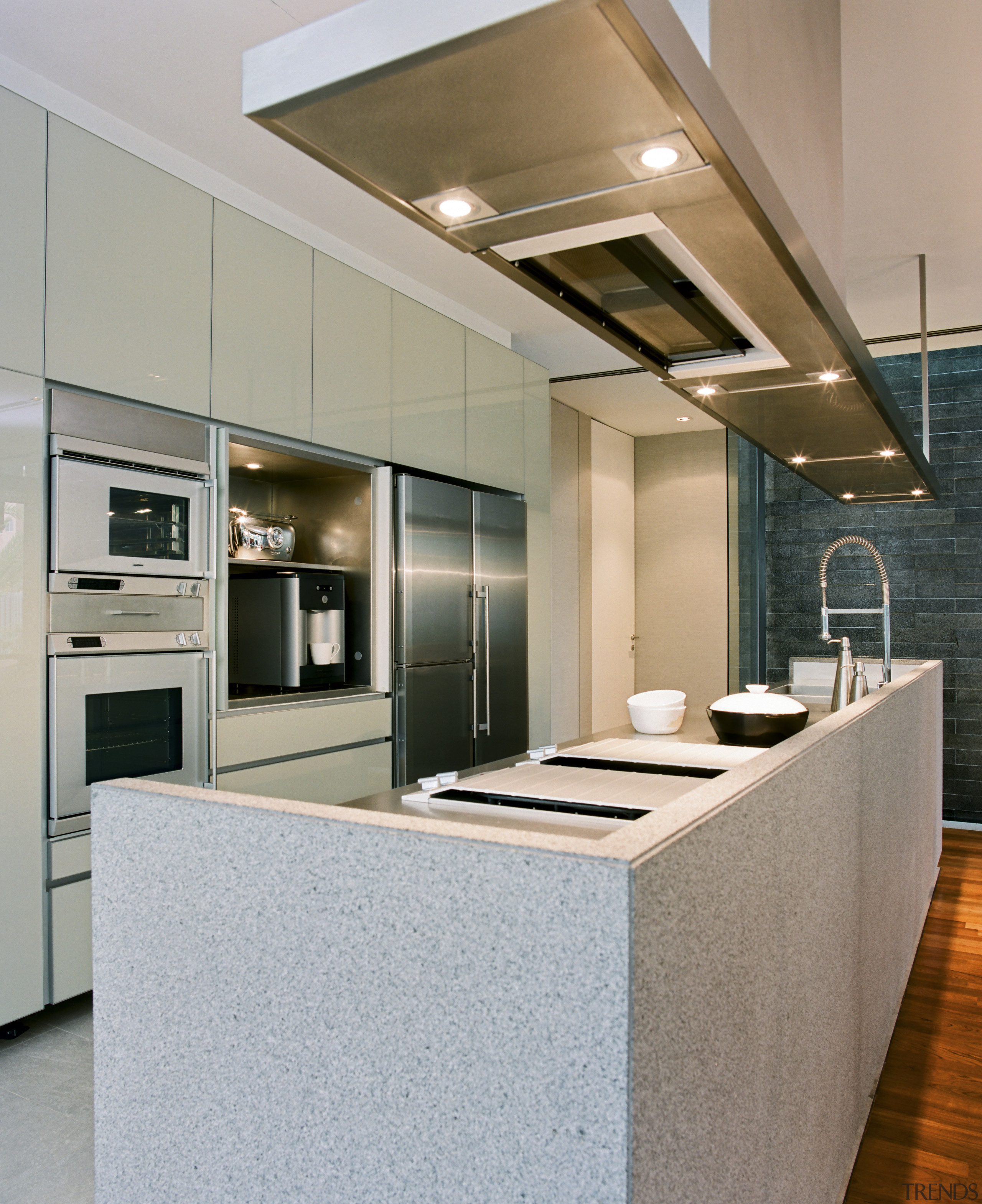 Finishes are neutral, allowing the bright furniture to cabinetry, countertop, cuisine classique, floor, interior design, kitchen, gray