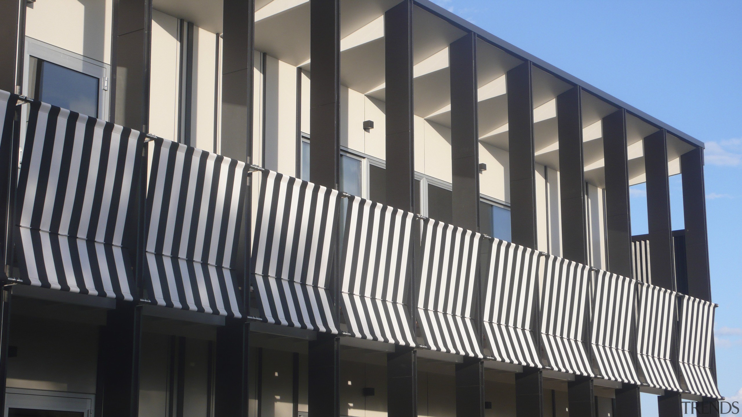 View of exterior with striped feature. - View architecture, brutalist architecture, building, commercial building, corporate headquarters, facade, property, real estate, structure, window, black