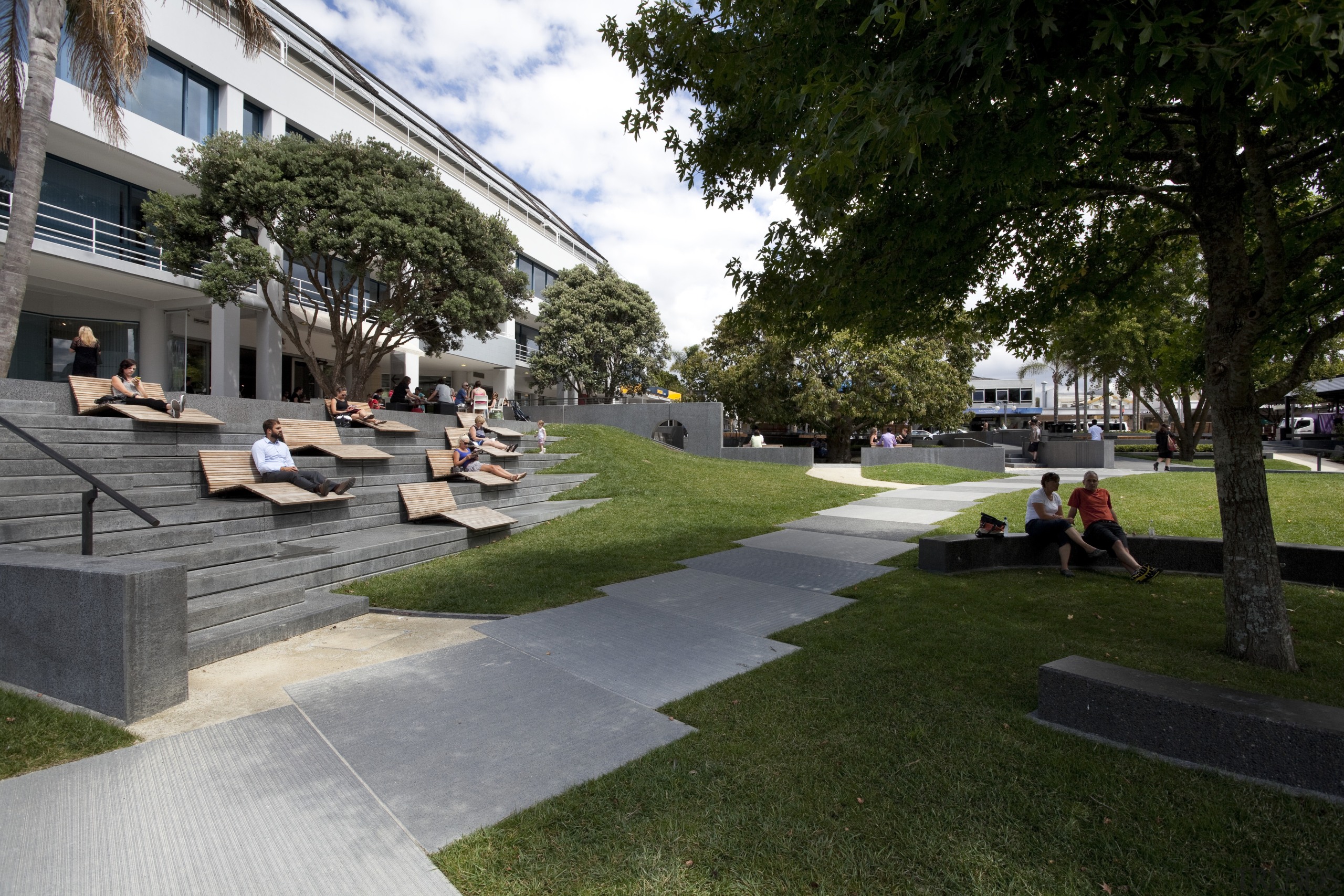 Hurstmere Green revitalises Takapuna - Hurstmere Green revitalises architecture, backyard, campus, condominium, courtyard, estate, grass, house, lawn, mixed use, neighbourhood, outdoor structure, park, plant, real estate, residential area, tree, urban design, walkway, yard, black, brown