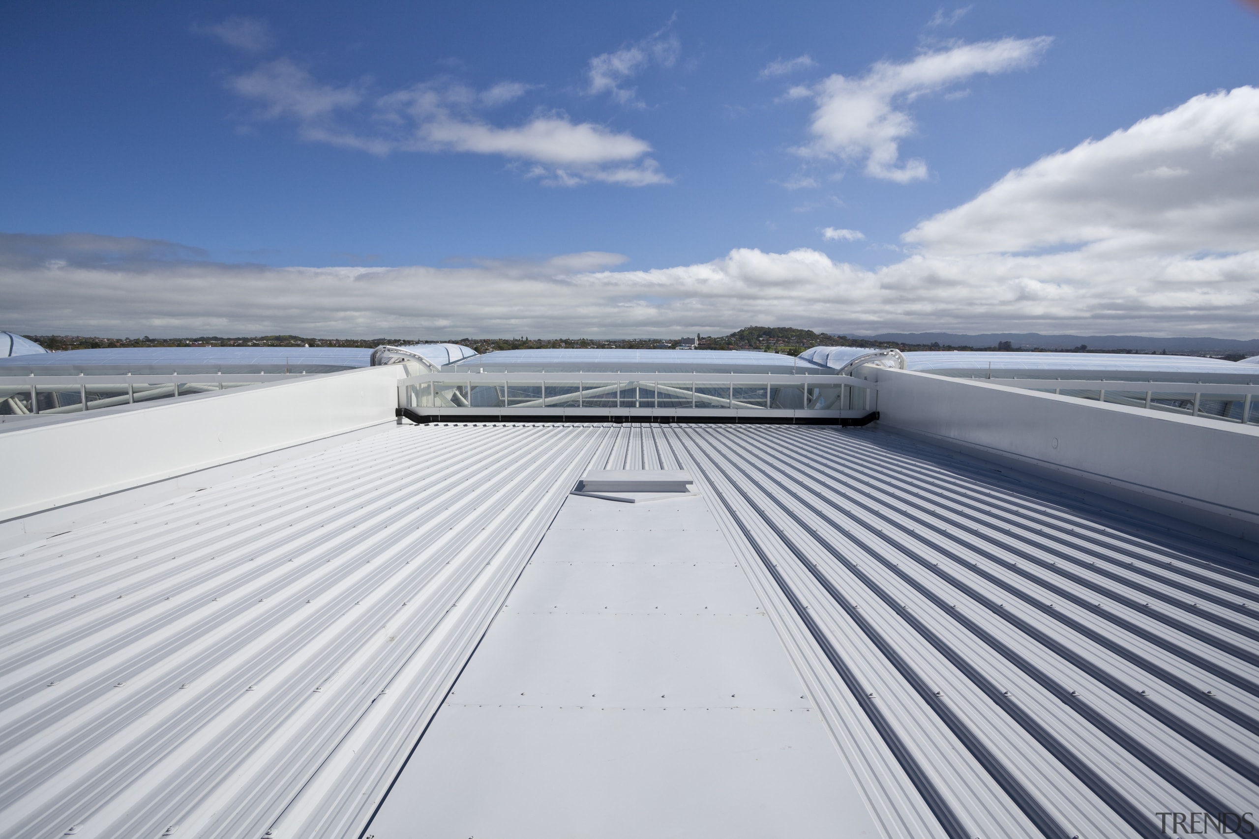 View of the cantilevered roof of the South boat, cloud, daylighting, daytime, deck, fixed link, line, roof, sea, sky, water, yacht, gray